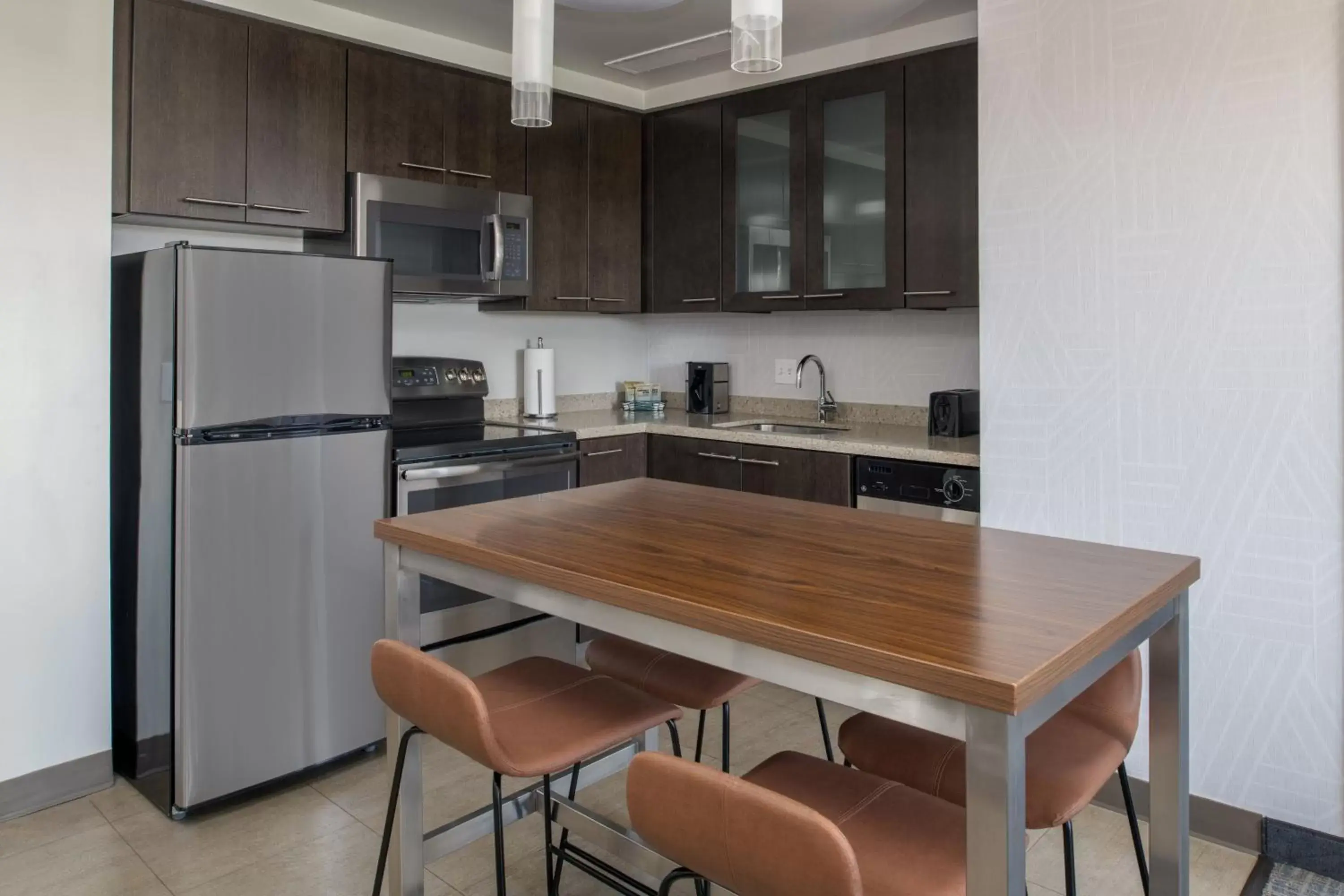 Bedroom, Kitchen/Kitchenette in Residence Inn by Marriott Portland Downtown/Pearl District