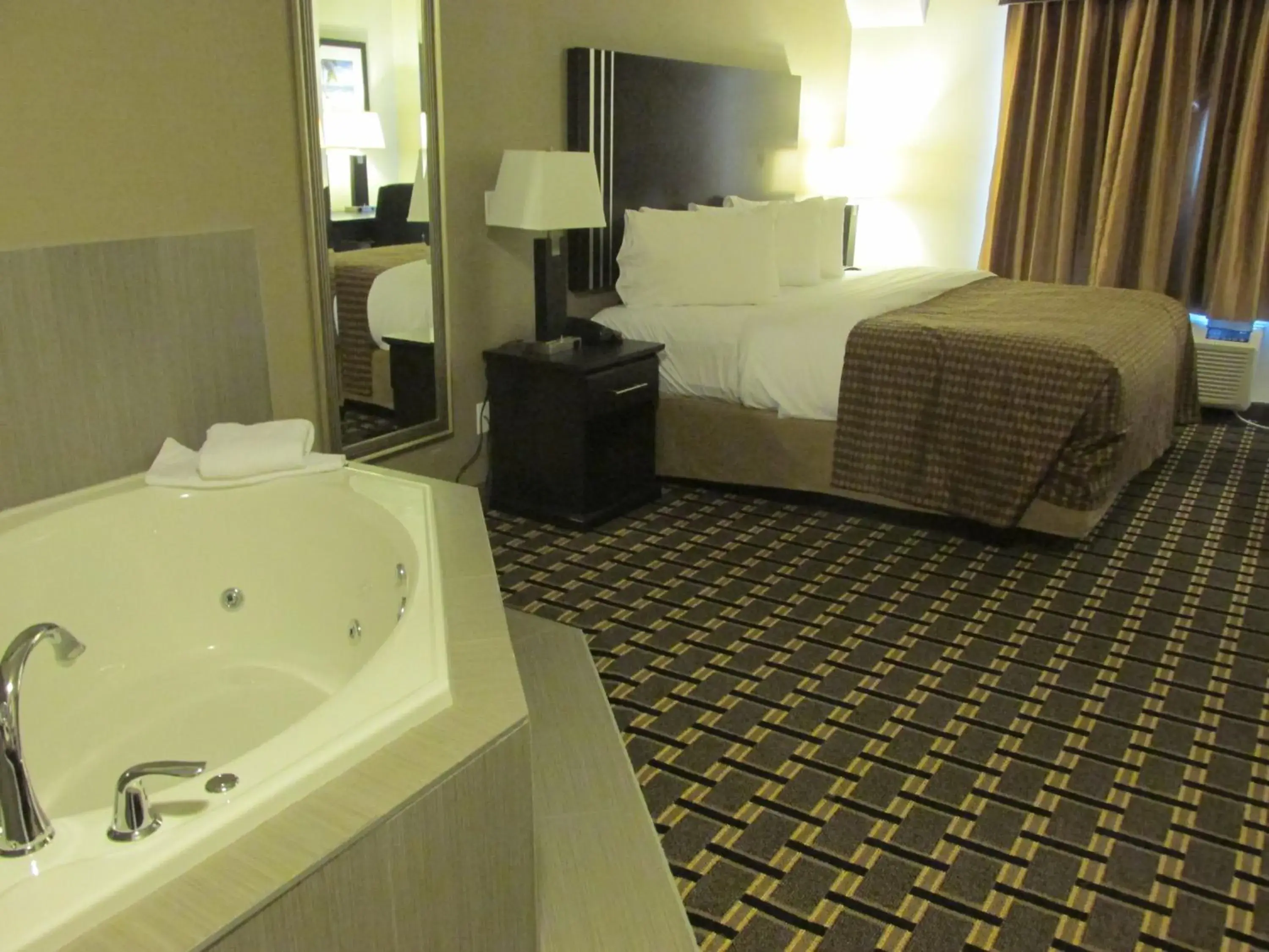 Bed, Bathroom in Sigma Inn & Suites