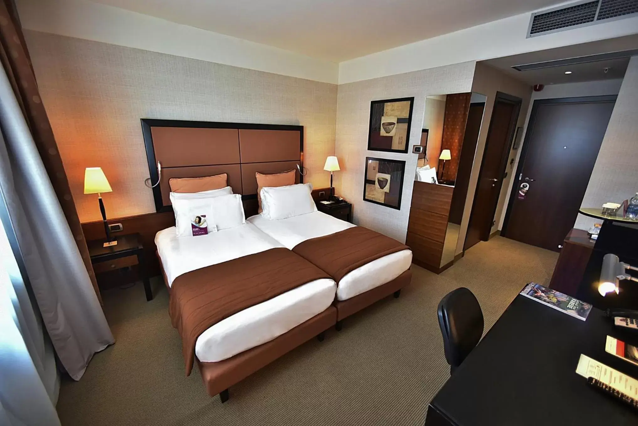 Photo of the whole room, Bed in Crowne Plaza Milan Malpensa Airport, an IHG Hotel