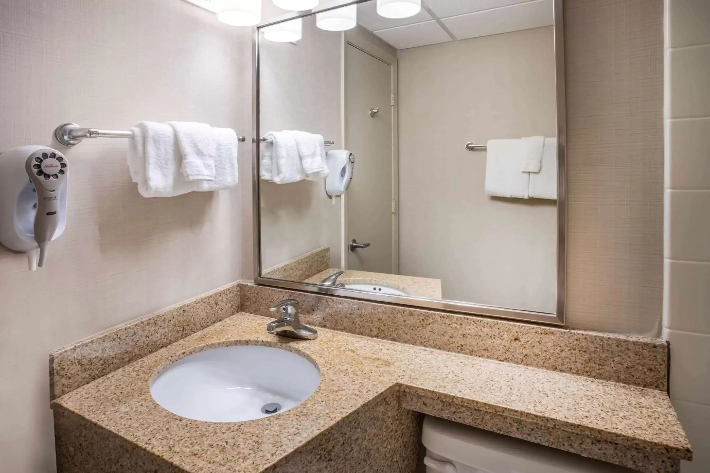 Bathroom in Days Inn & Suites by Wyndham Duluth by the Mall