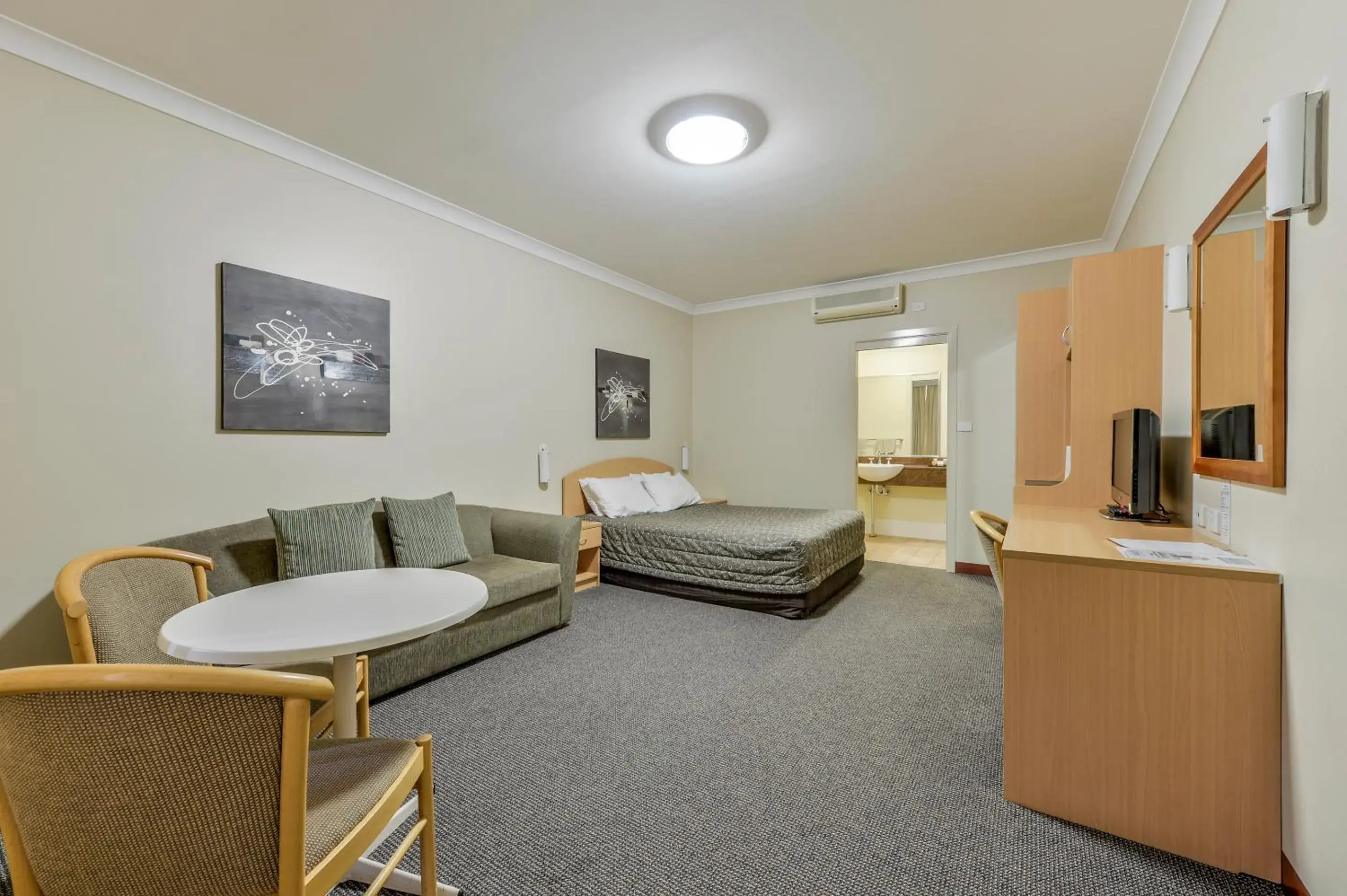 Photo of the whole room, Seating Area in Golden Guitar Motor Inn