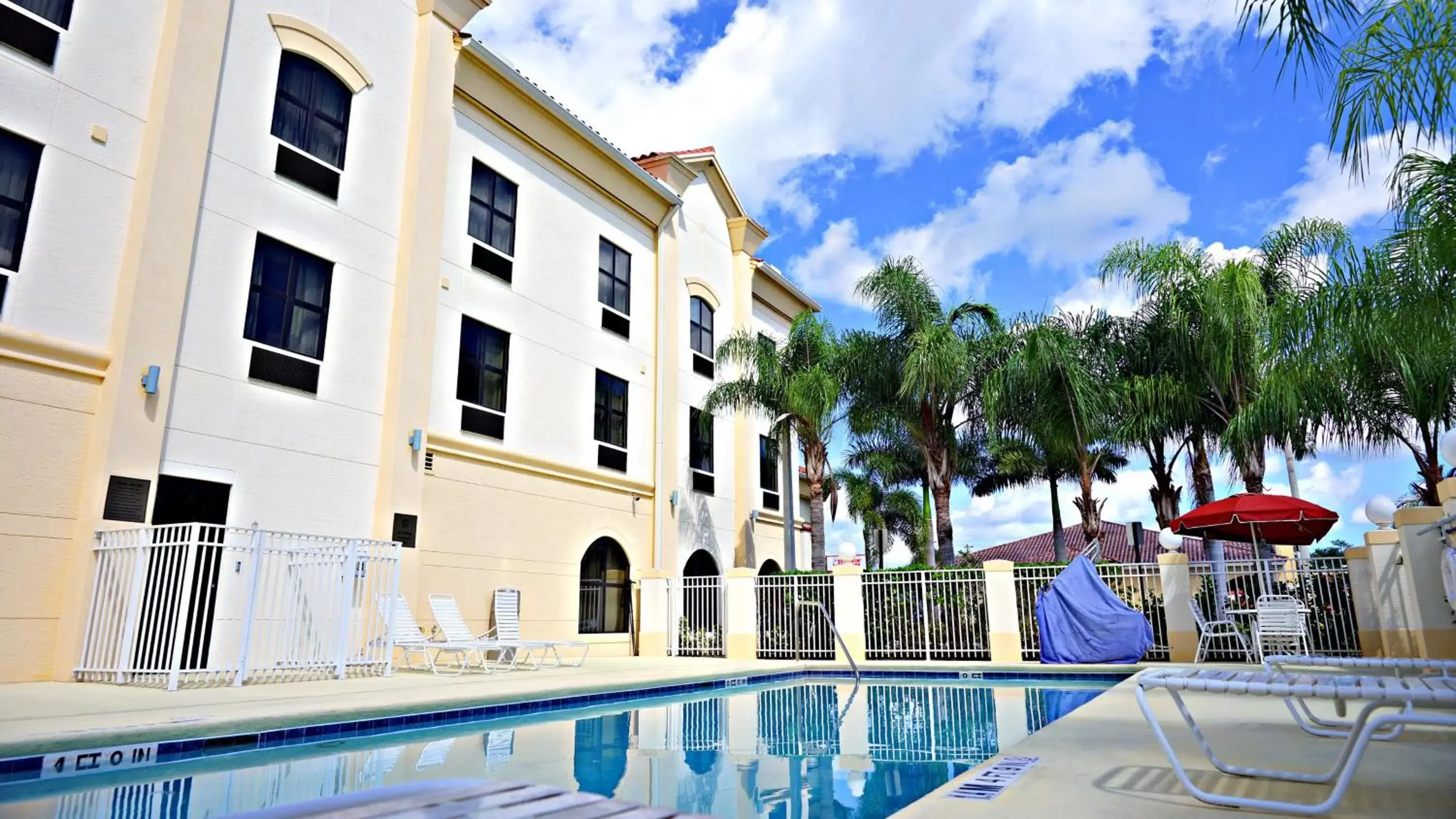 Swimming pool, Property Building in Holiday Inn Express Stuart, an IHG Hotel