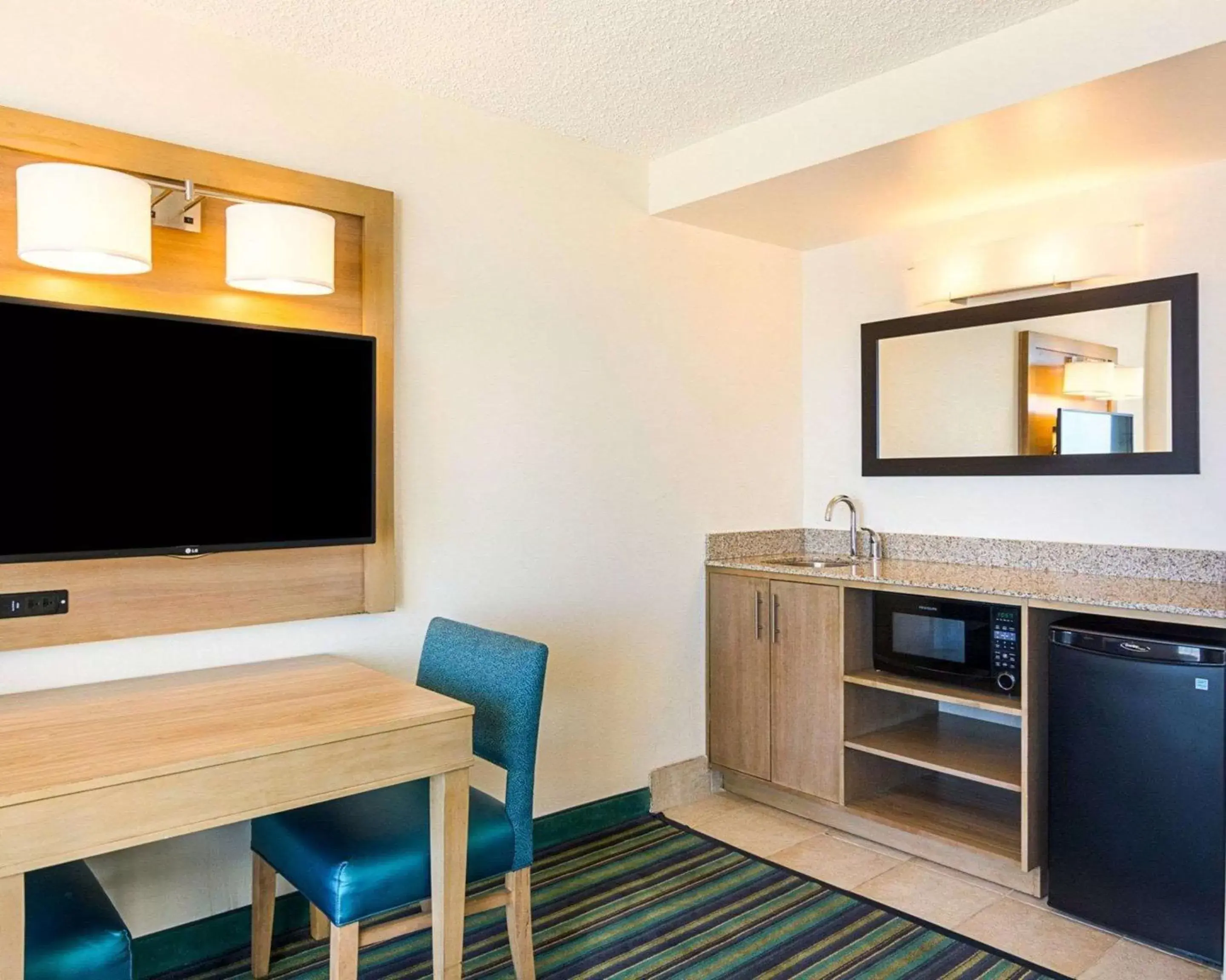 Photo of the whole room, TV/Entertainment Center in Comfort Suites Beachfront