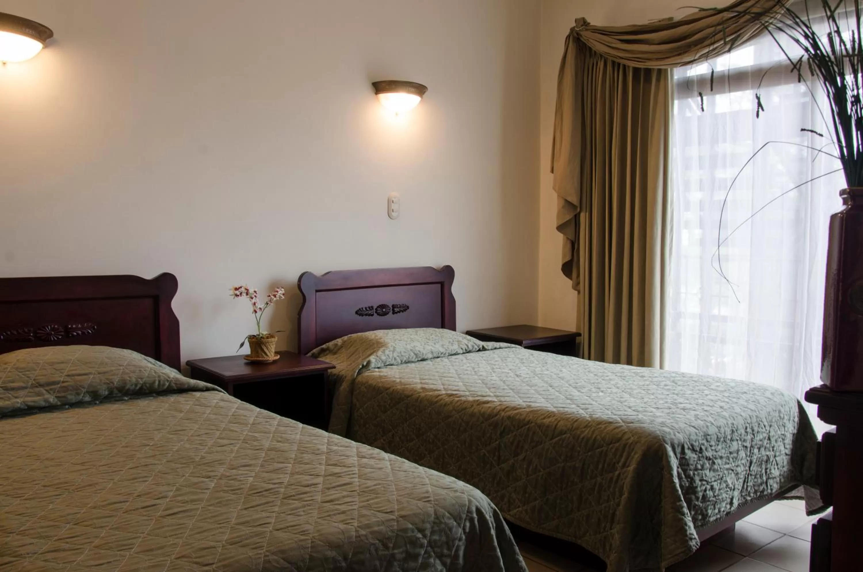 Bedroom, Bed in Hotel Plaza Real Suites & Apartments San Jose