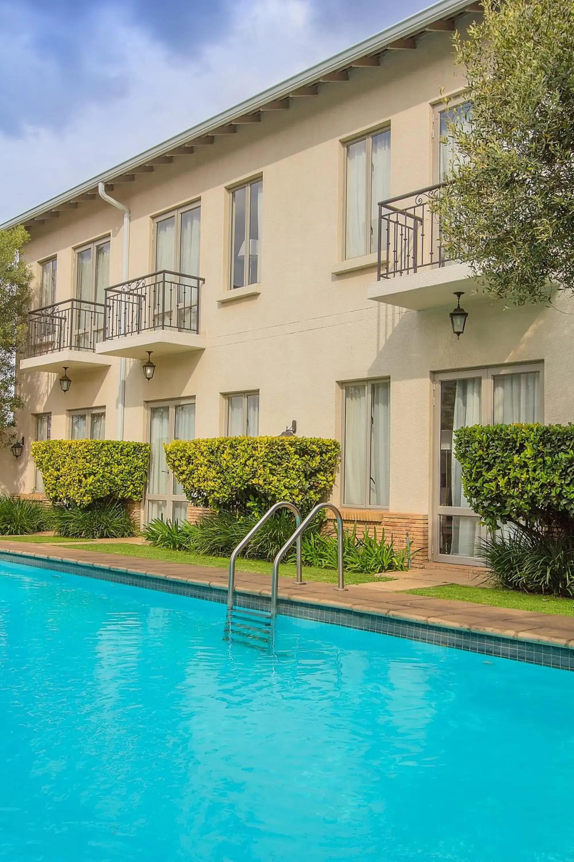 Swimming pool, Property Building in The Syrene Boutique Hotel