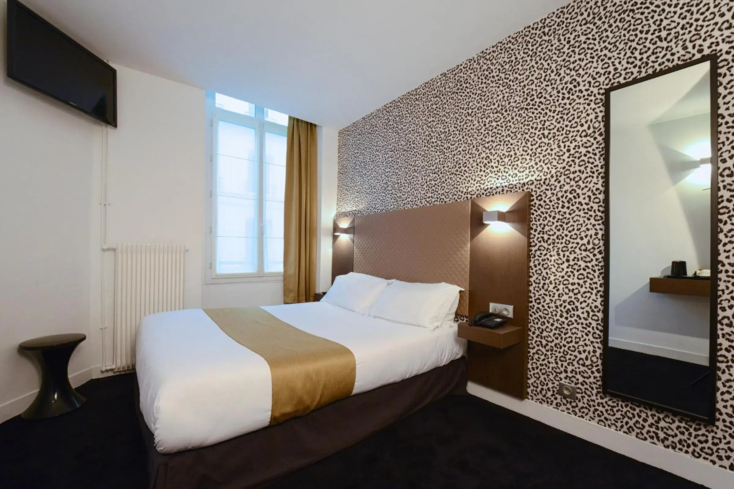 Photo of the whole room, Bed in Hôtel de la Gaîté