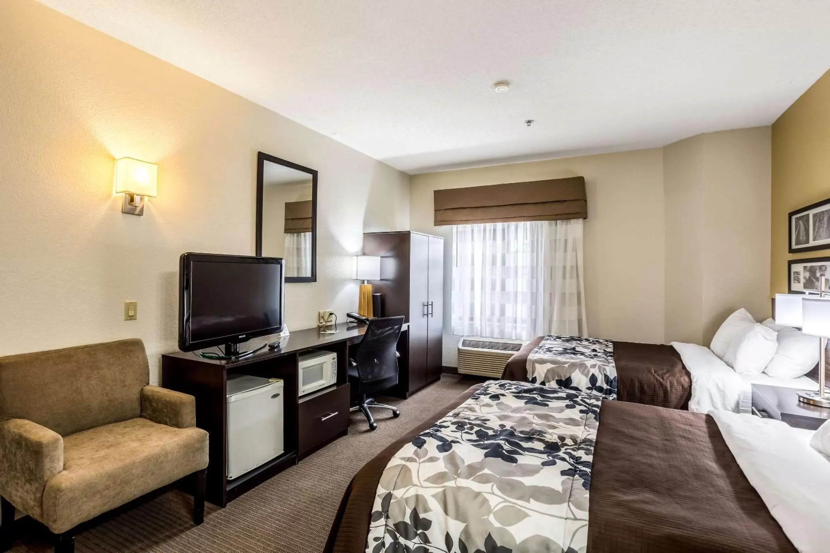 Photo of the whole room, TV/Entertainment Center in Sleep Inn Owensboro