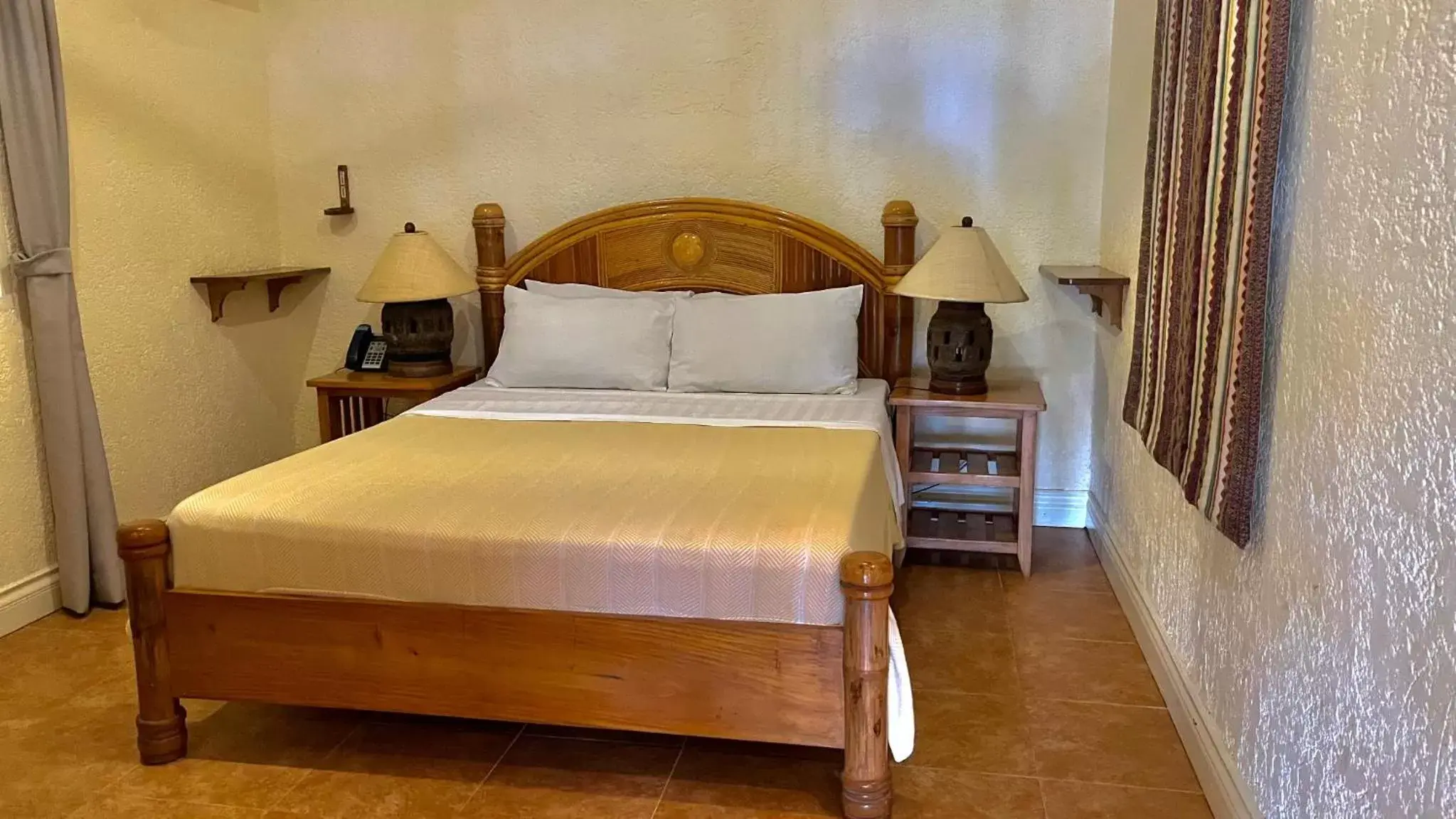 Bed in Coco Grove Beach Resort, Siquijor Island