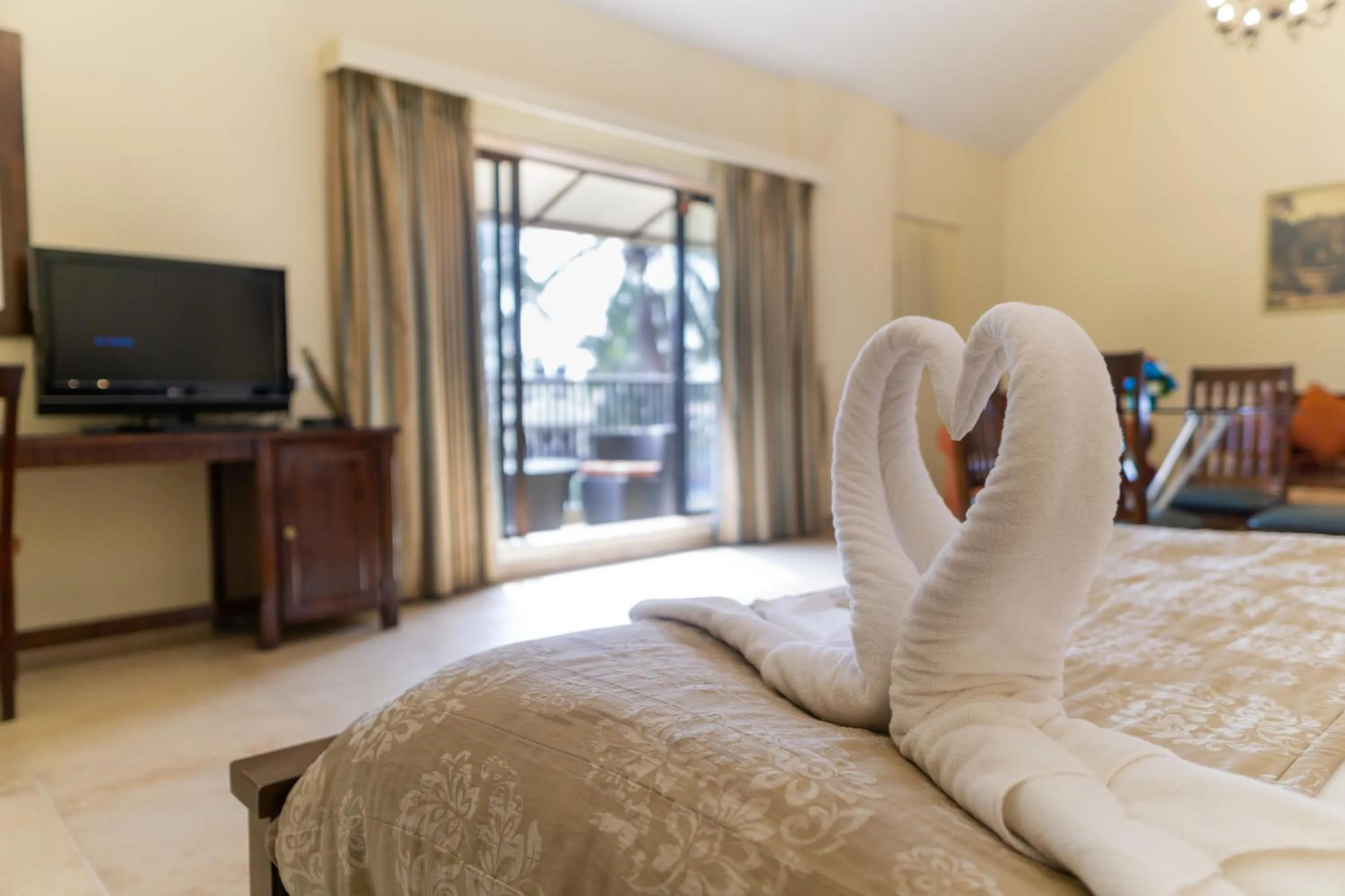 Bed in Neelam's The Grand Hotel Goa