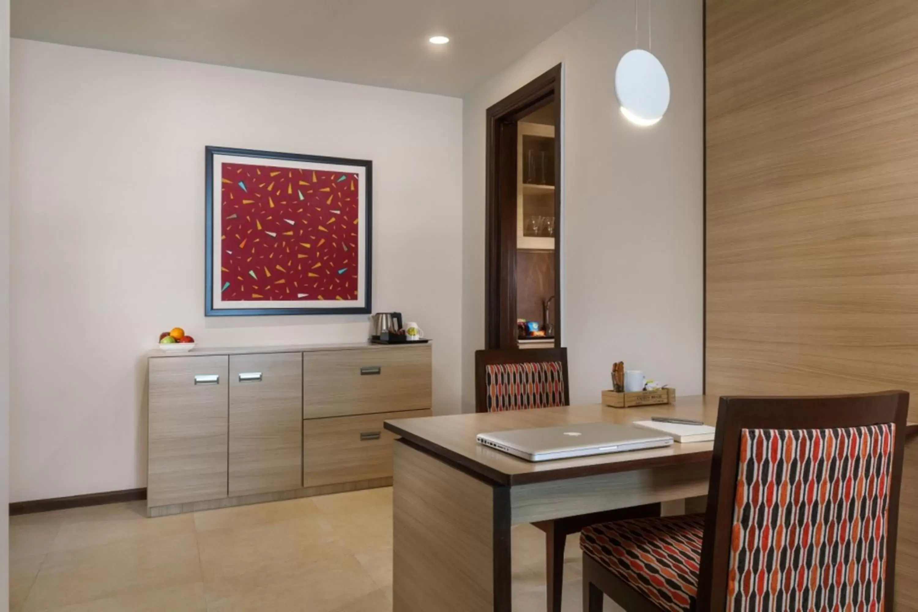 Dining area in Sandal Suites by Lemon Tree Hotels