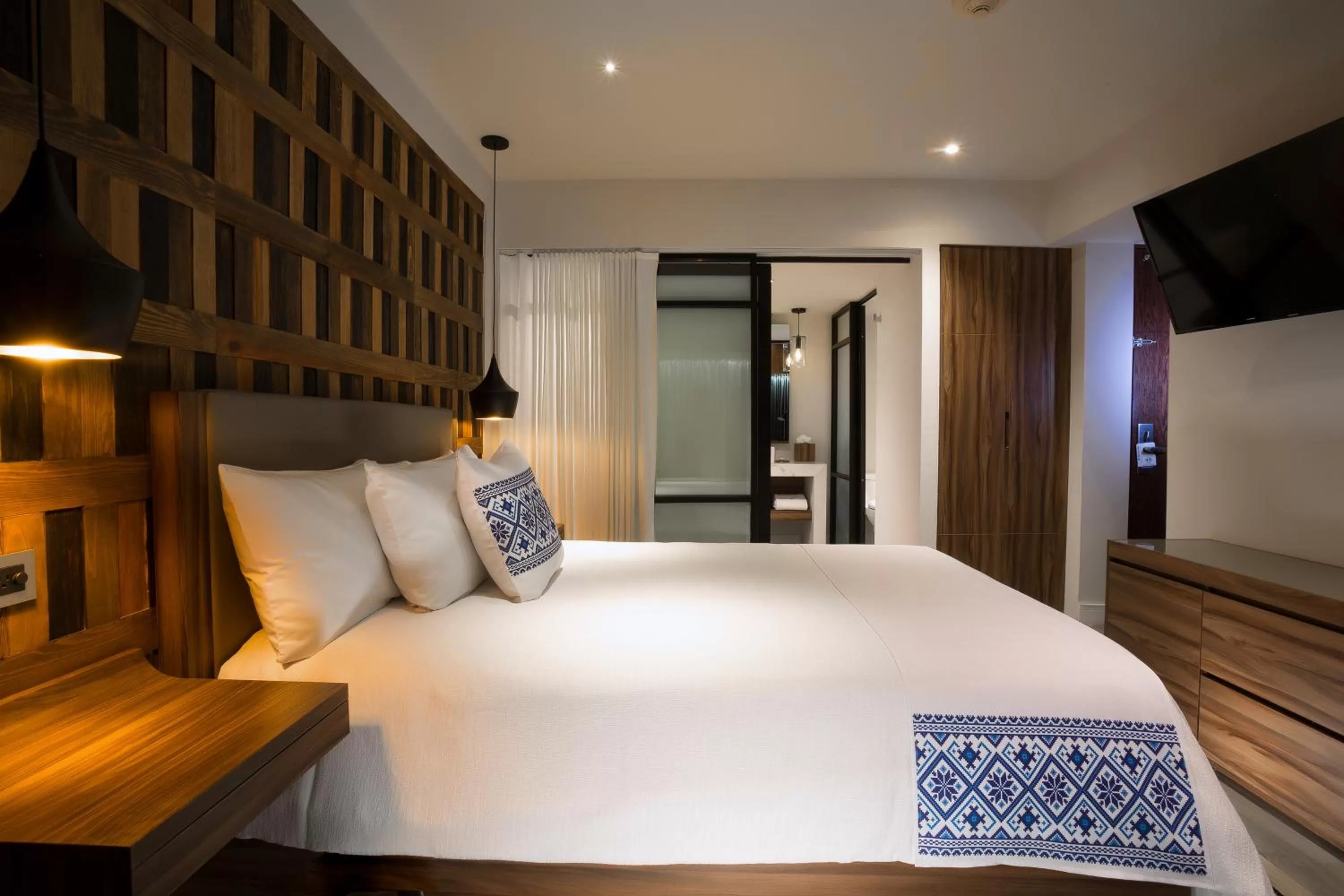 Bed in Hotel Indigo Guadalajara Expo by IHG