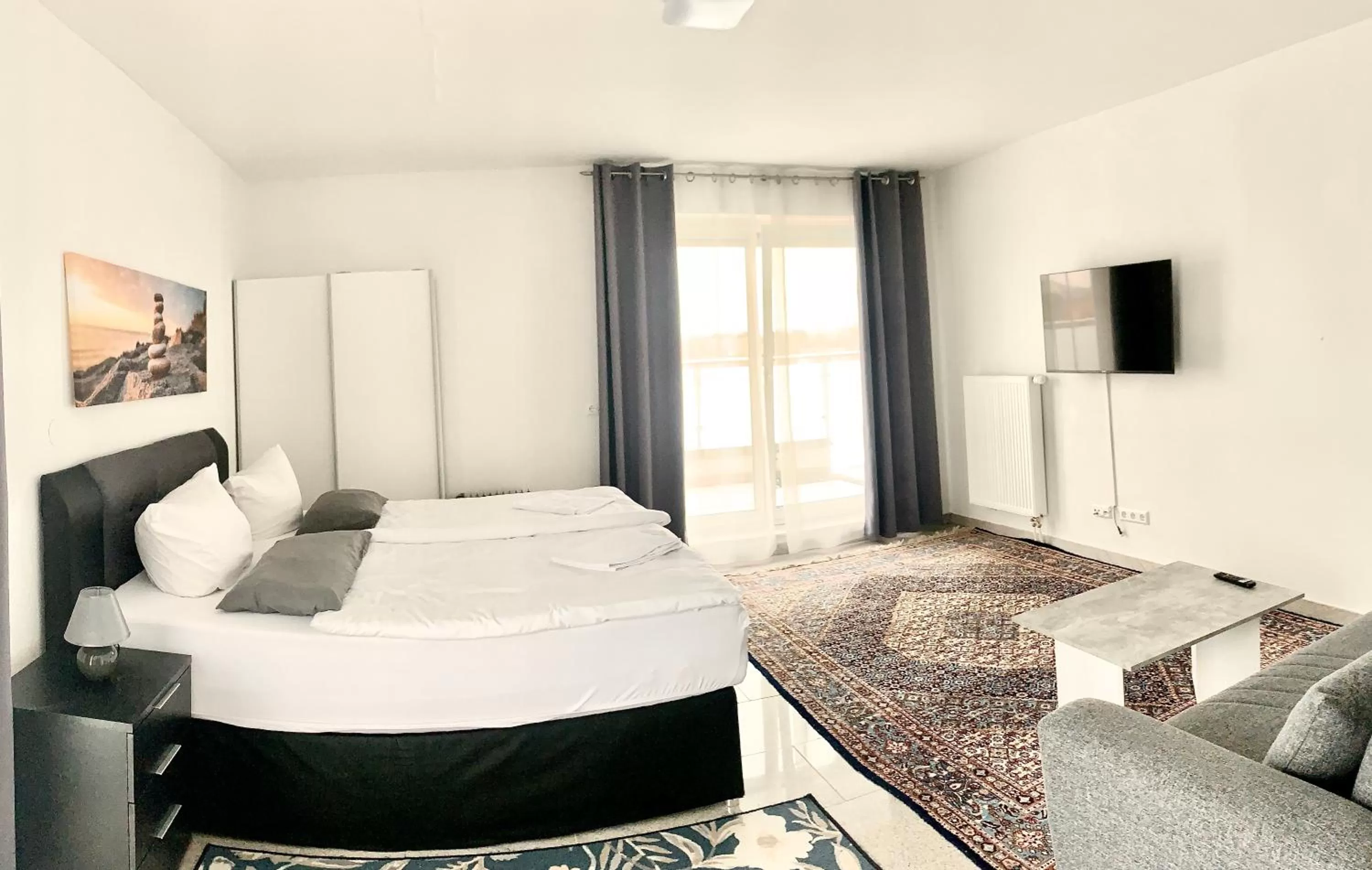 Living room, Bed in Pent - Aparthotel Crailsheim