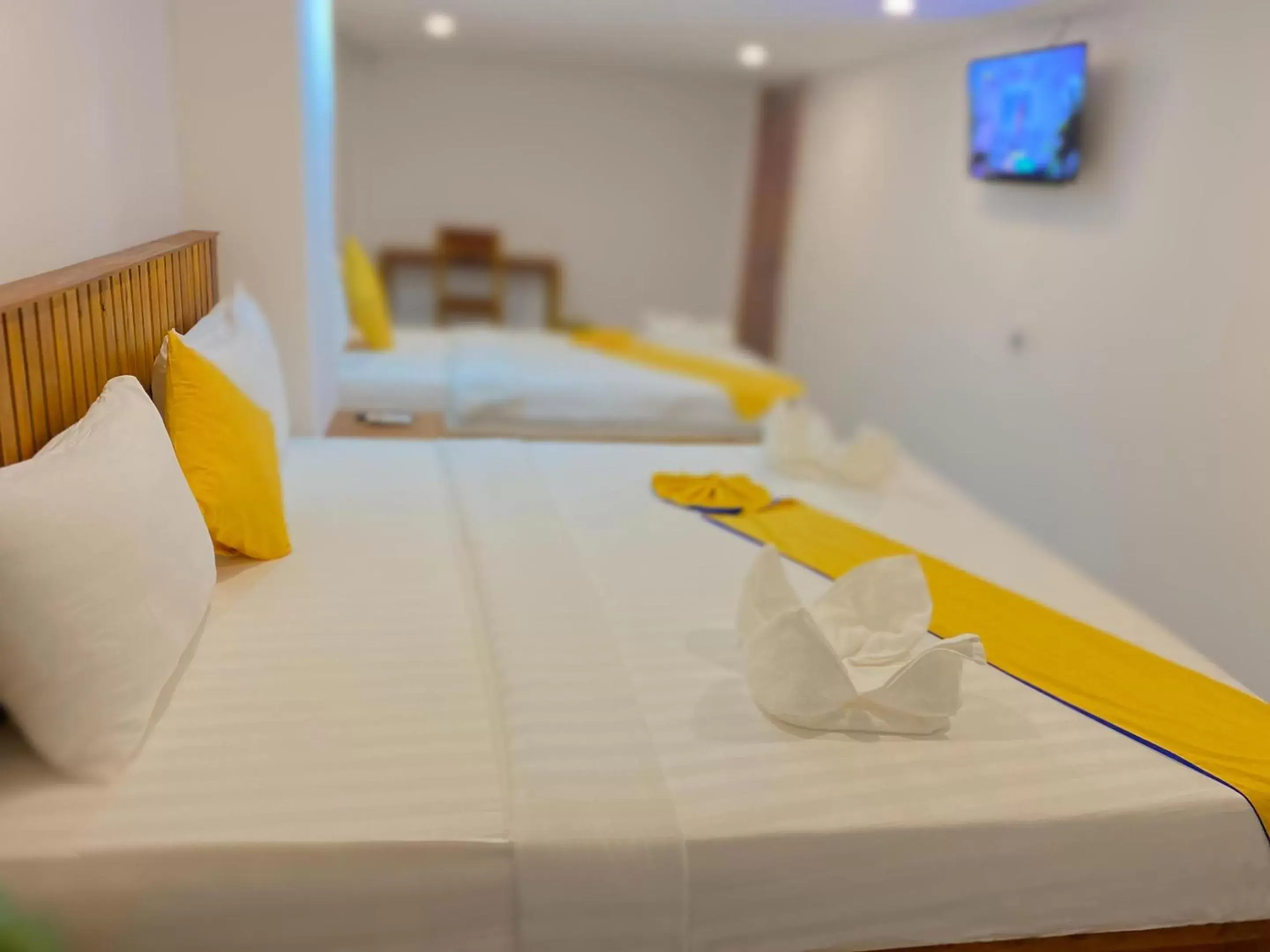 Bed in Grand Elevation Hotel