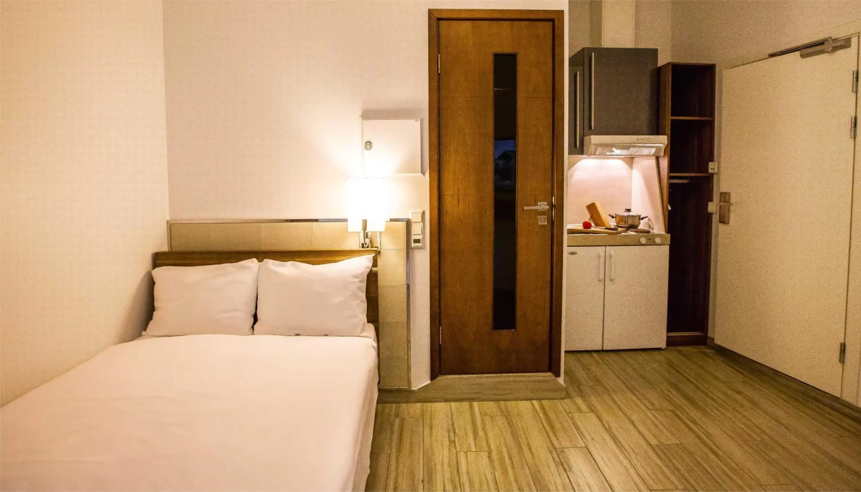 Photo of the whole room, Bed in Central City Apartments