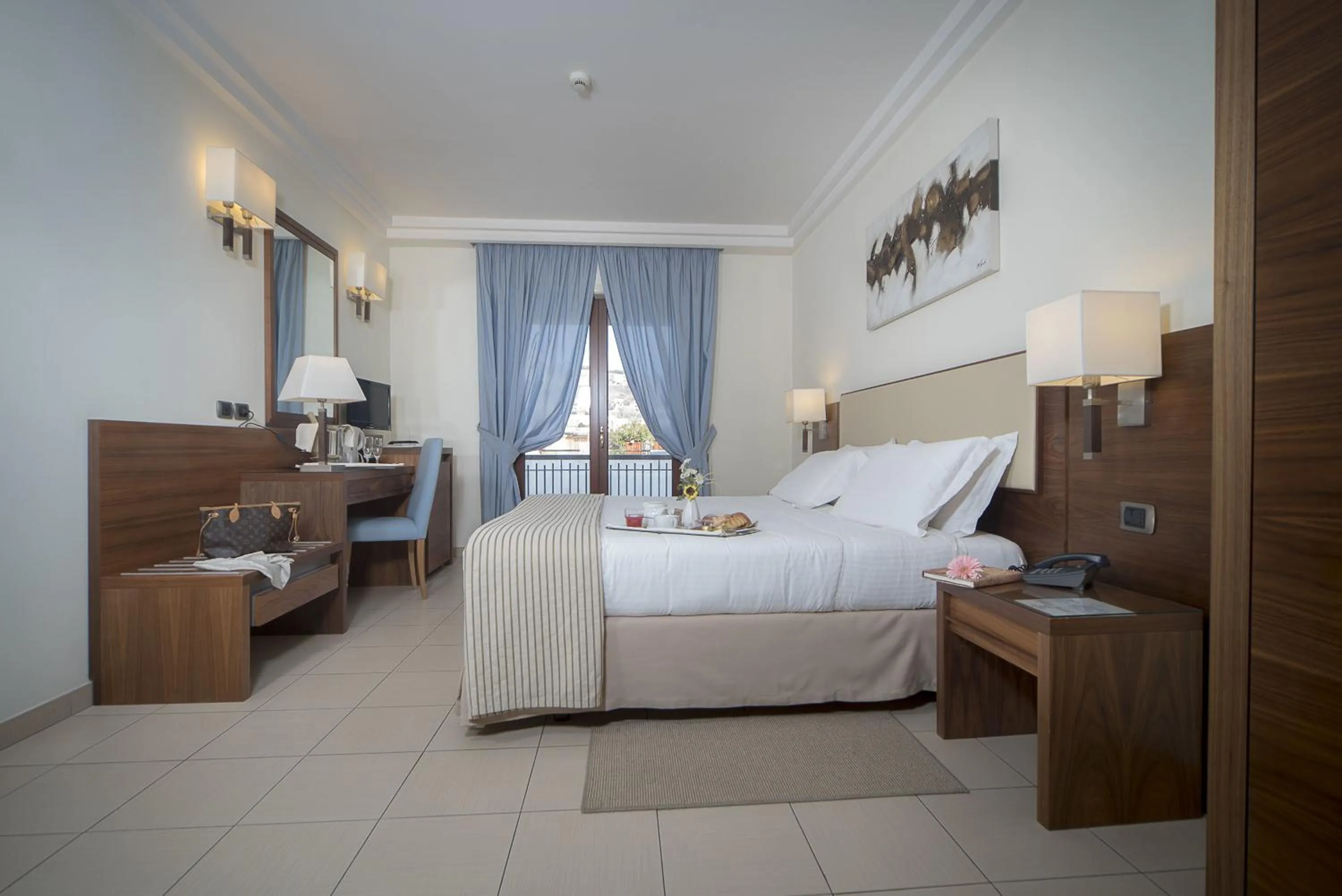 Bed in Suites & Residence Hotel