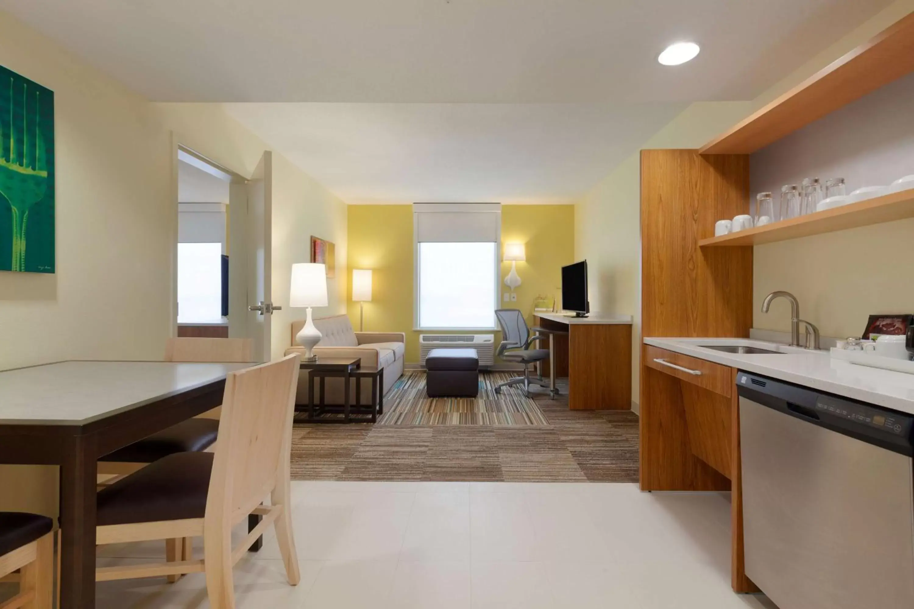 Bed, Kitchen/Kitchenette in Home2 Suites by Hilton Champaign/Urbana