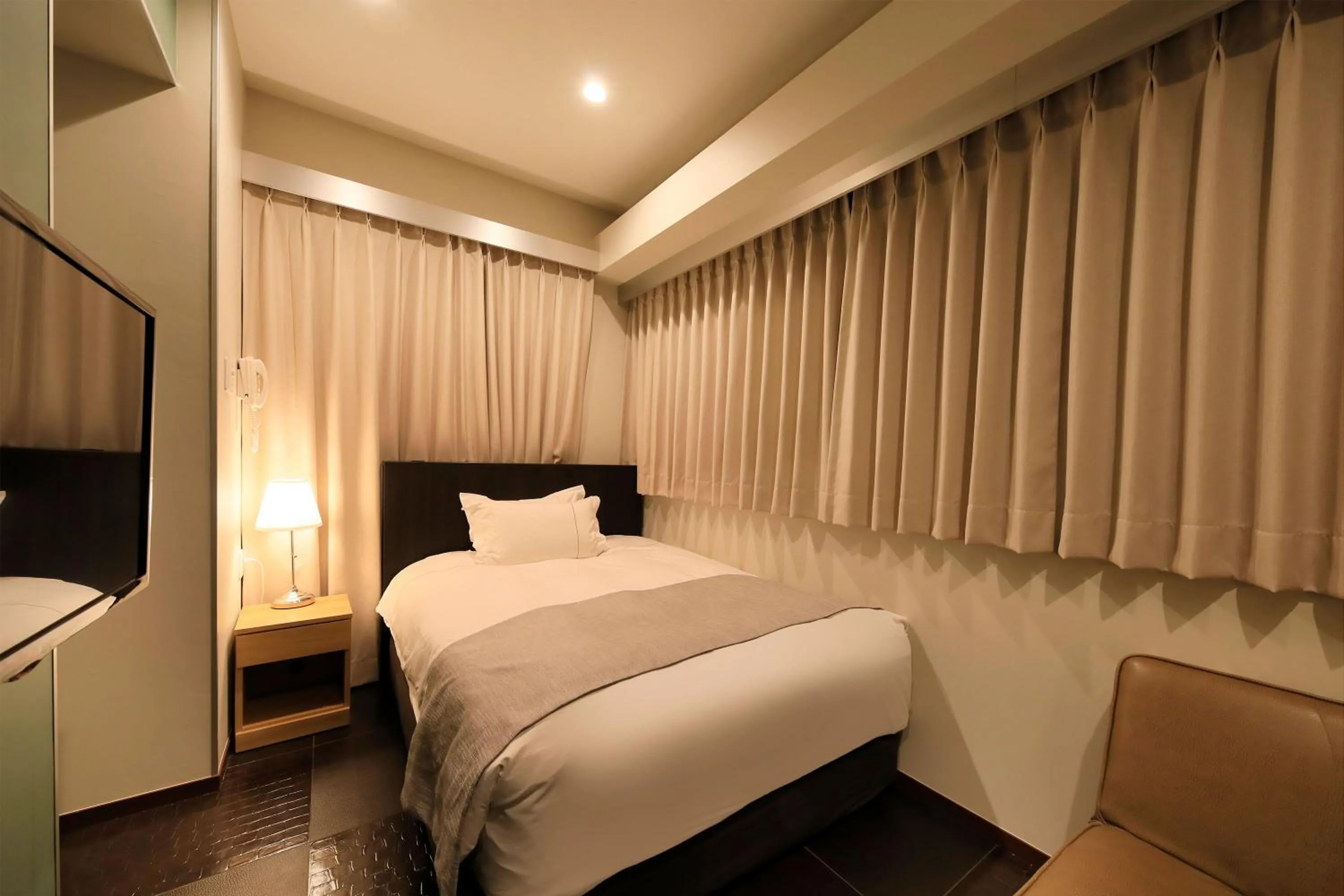 Photo of the whole room, Bed in Centurion Hotel Residential Akasaka Station