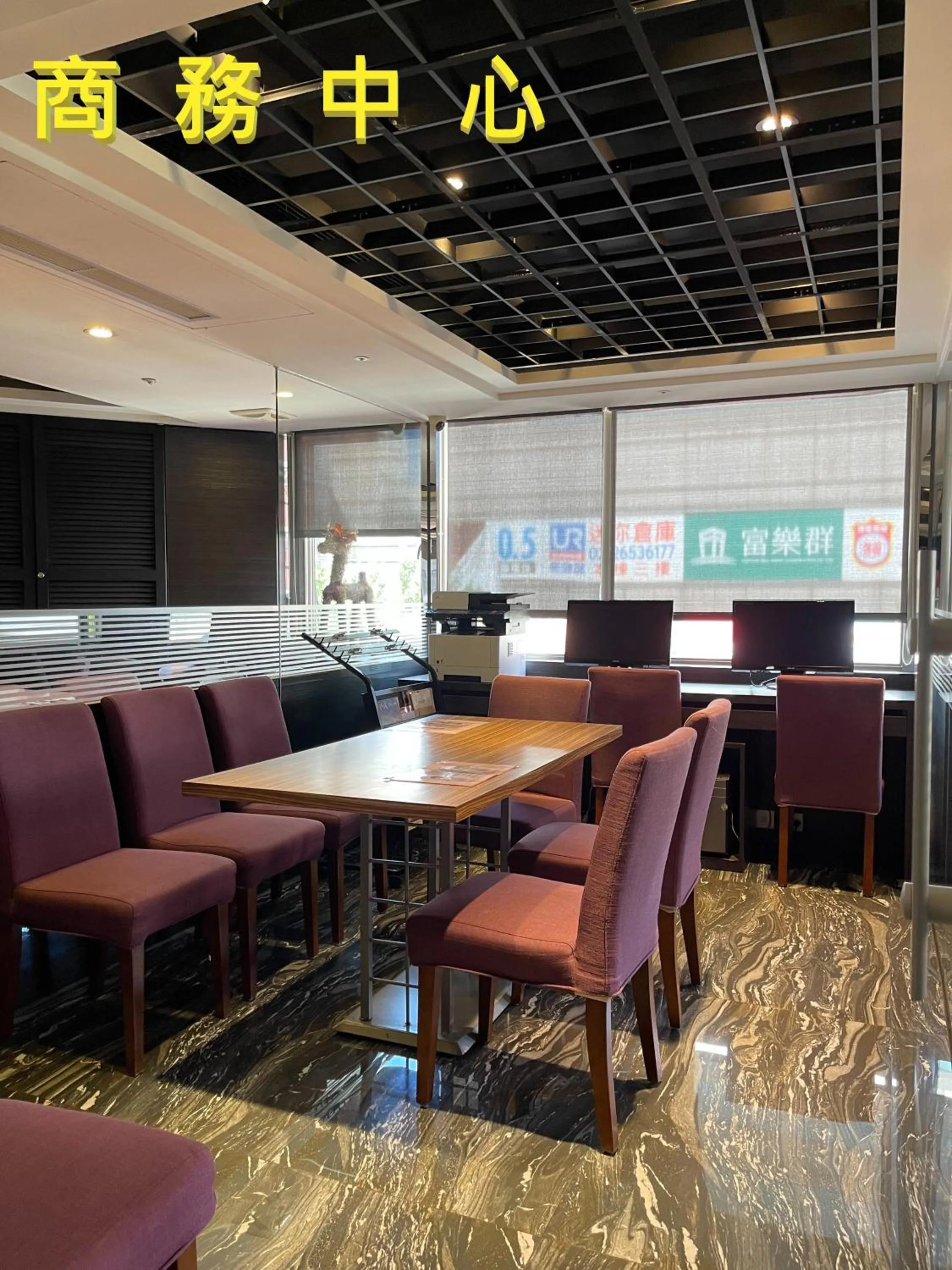 Communal lounge/ TV room in V-one Vogue Hotel