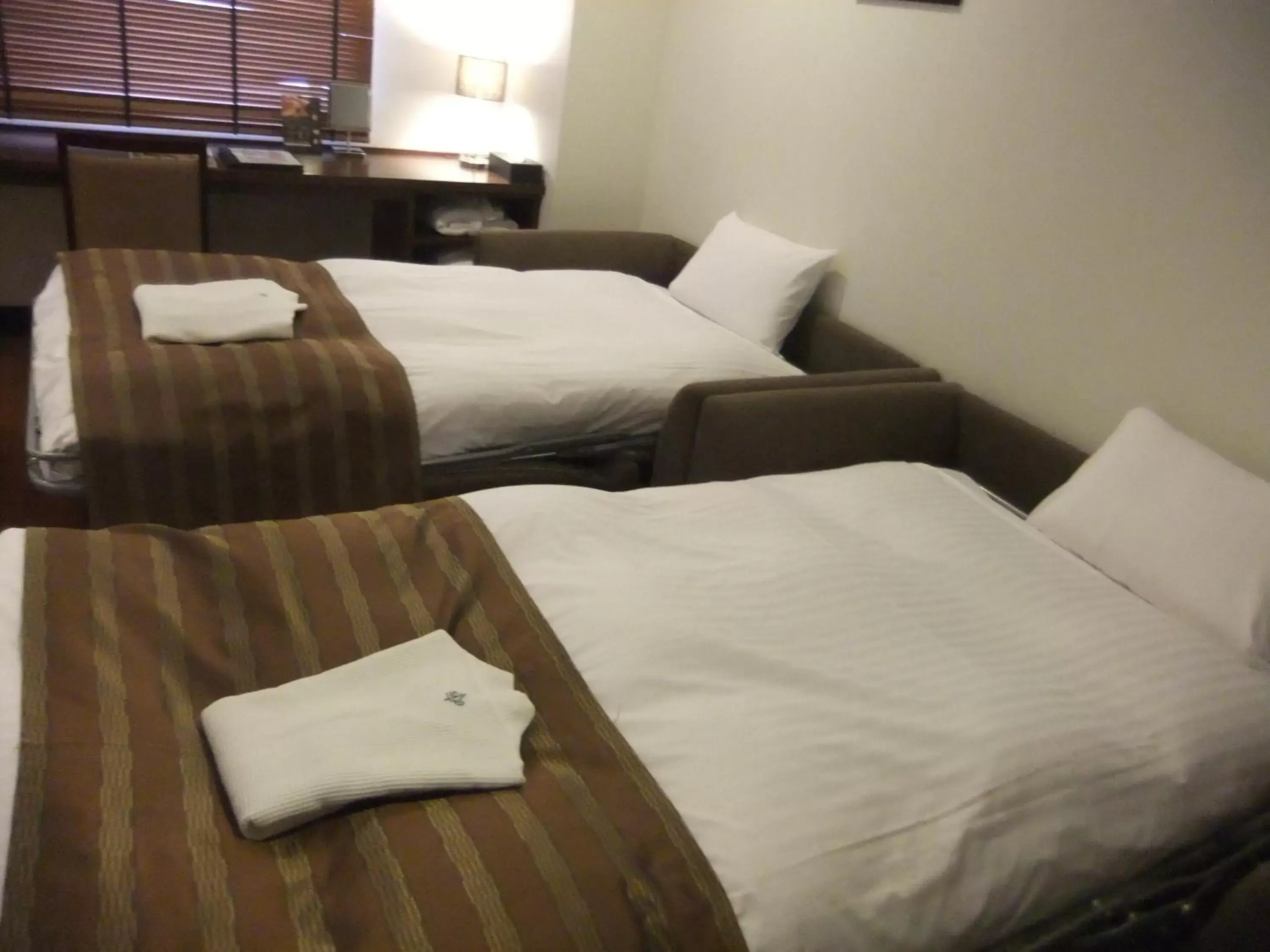 Bed in Sutton Hotel Hakata City