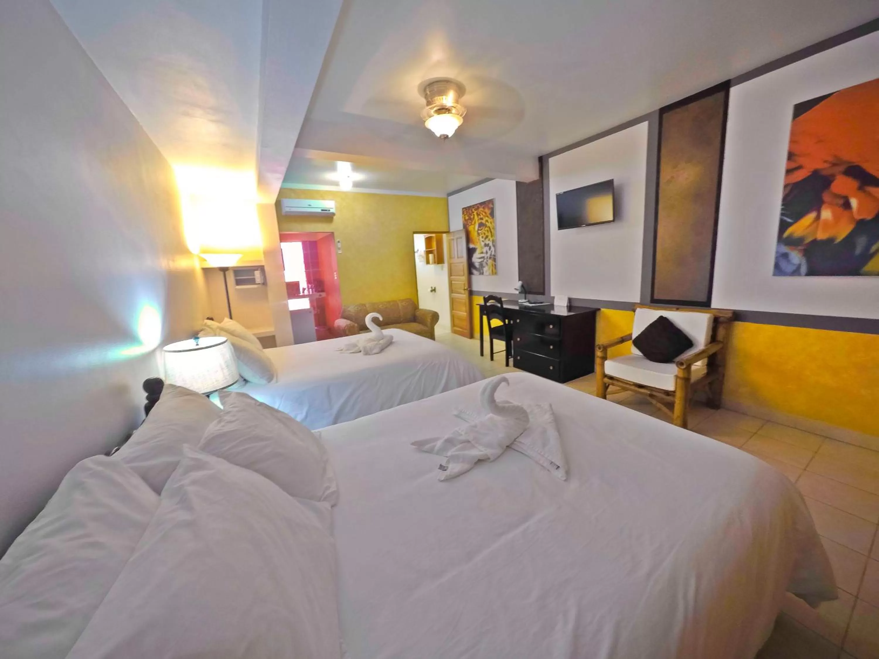 Bed in Rumors Resort Hotel