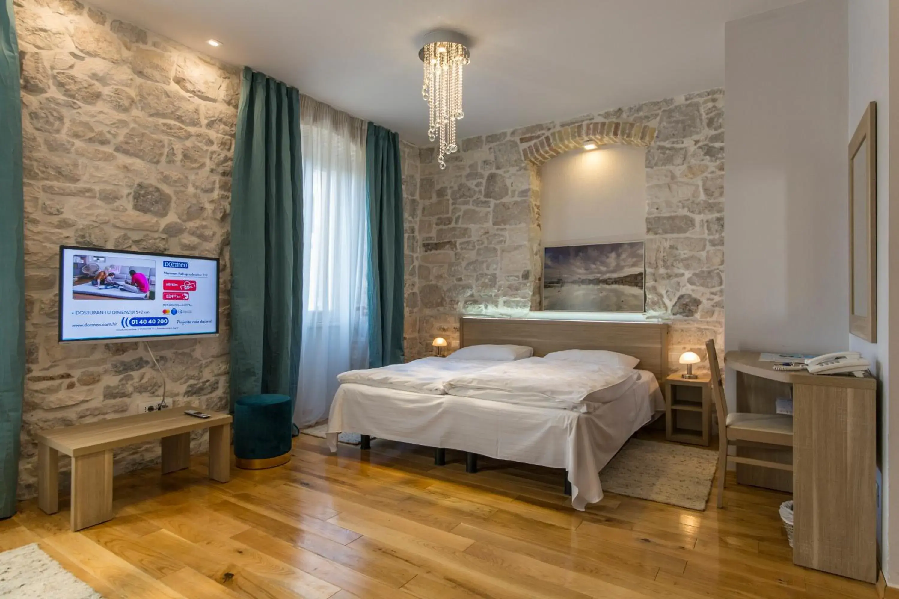 Bed in Tifani Luxury Rooms