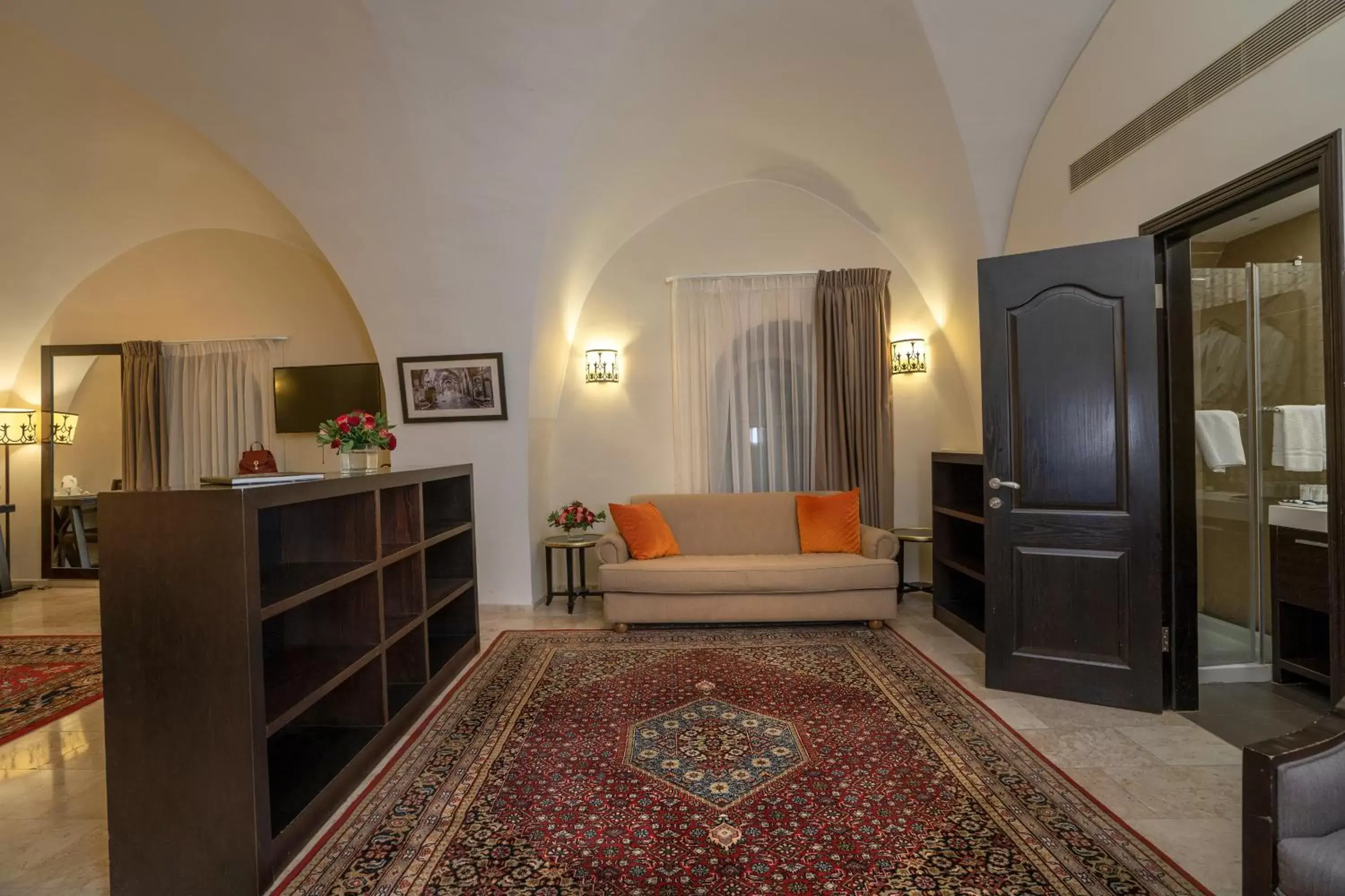 Bed, TV/Entertainment Center in The Sephardic House Hotel in The Jewish Quarter