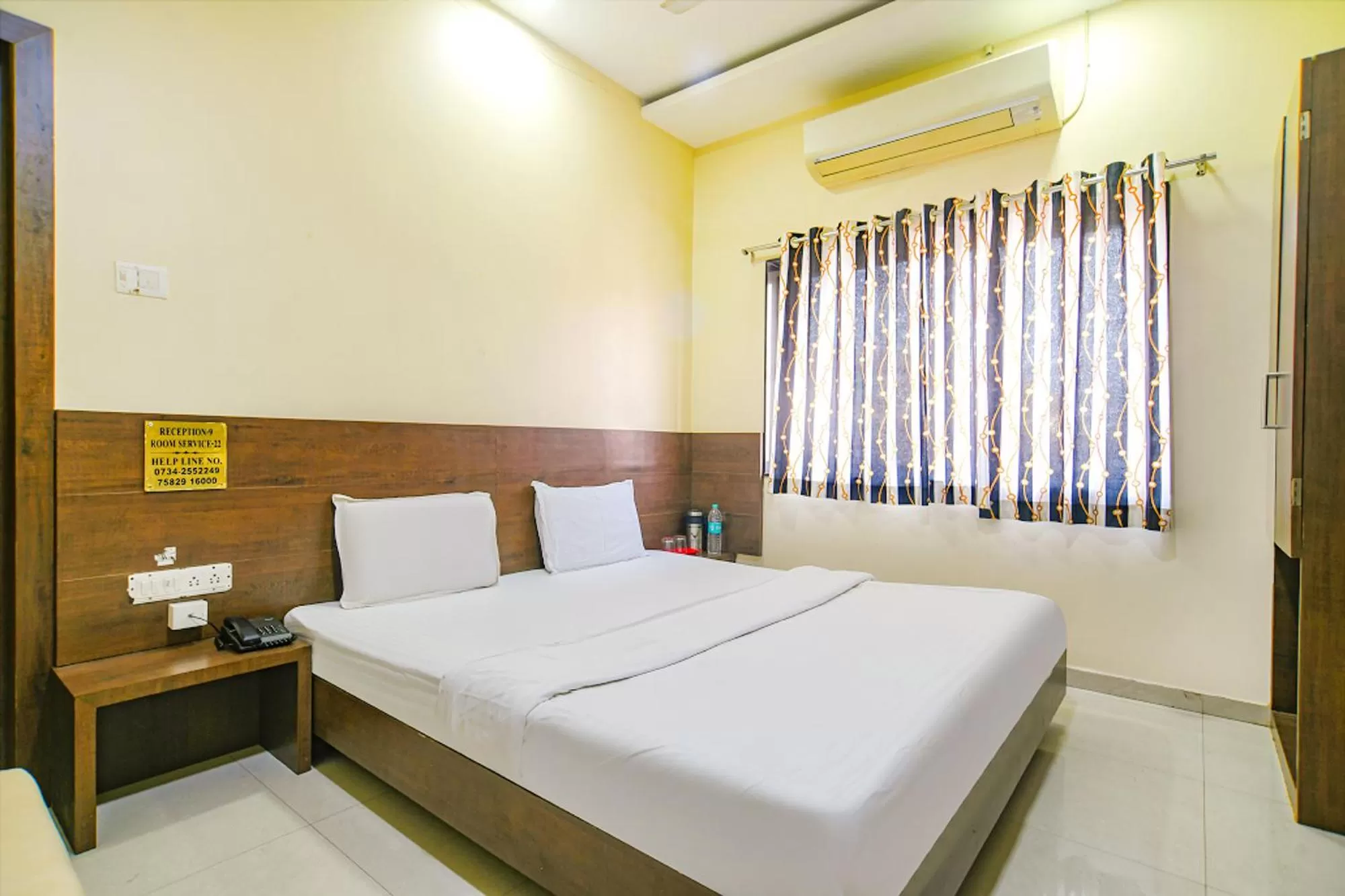Bed in FabHotel Satyug Jaisinghpura