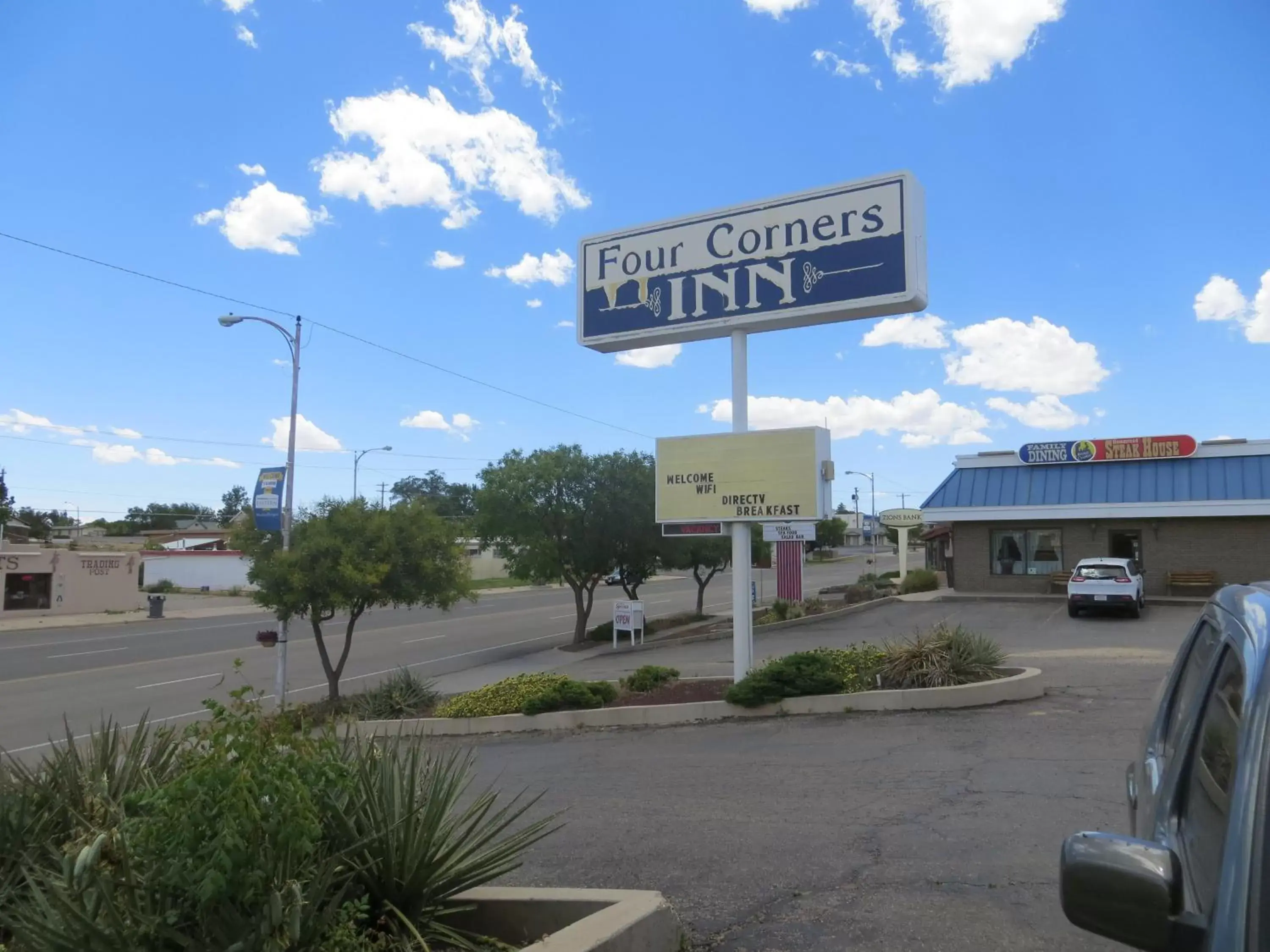 Property logo or sign in Four Corners Inn