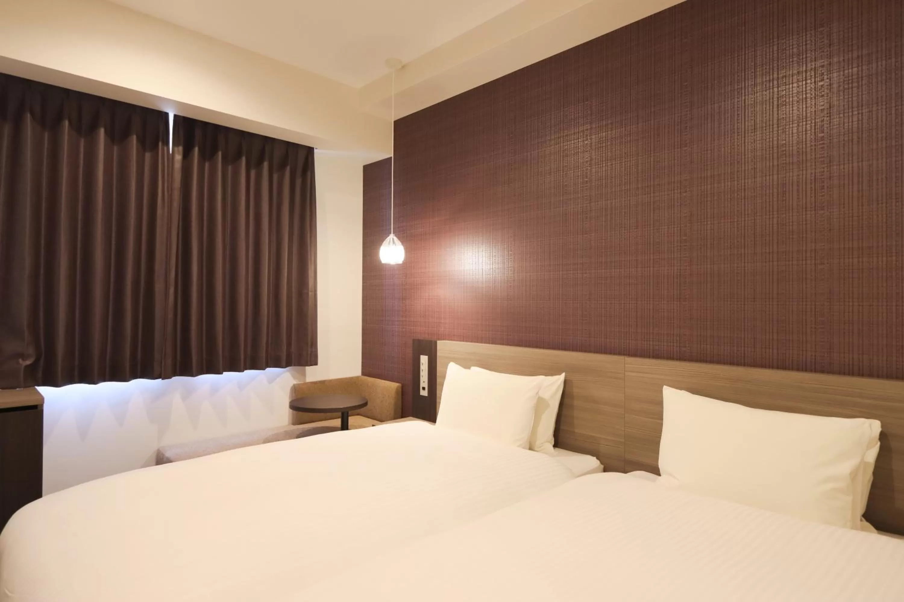 Bed in Wander Kyoto Nanajo