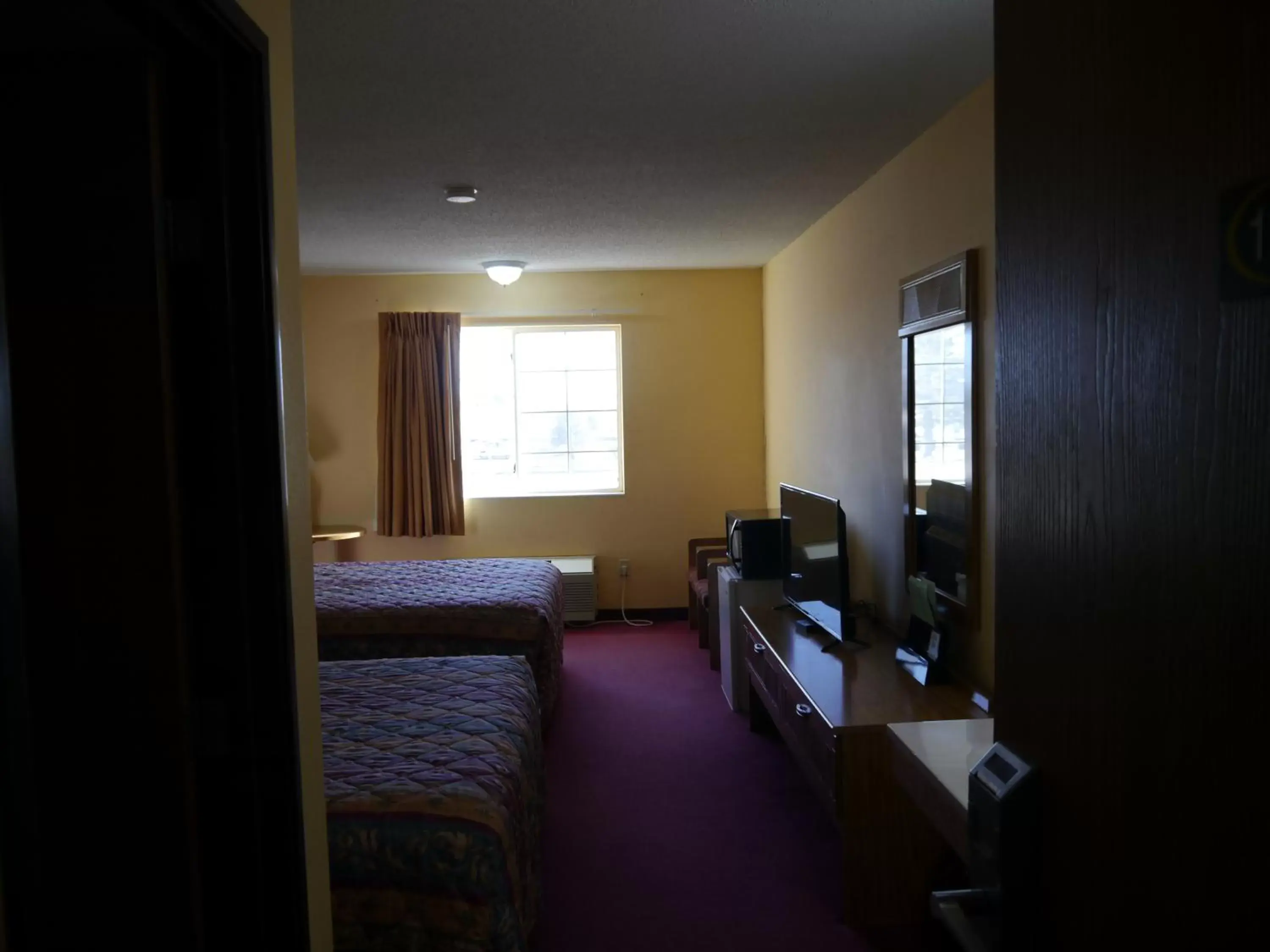 Day, TV/Entertainment Center in Westwood Inn & Suites - Kimball