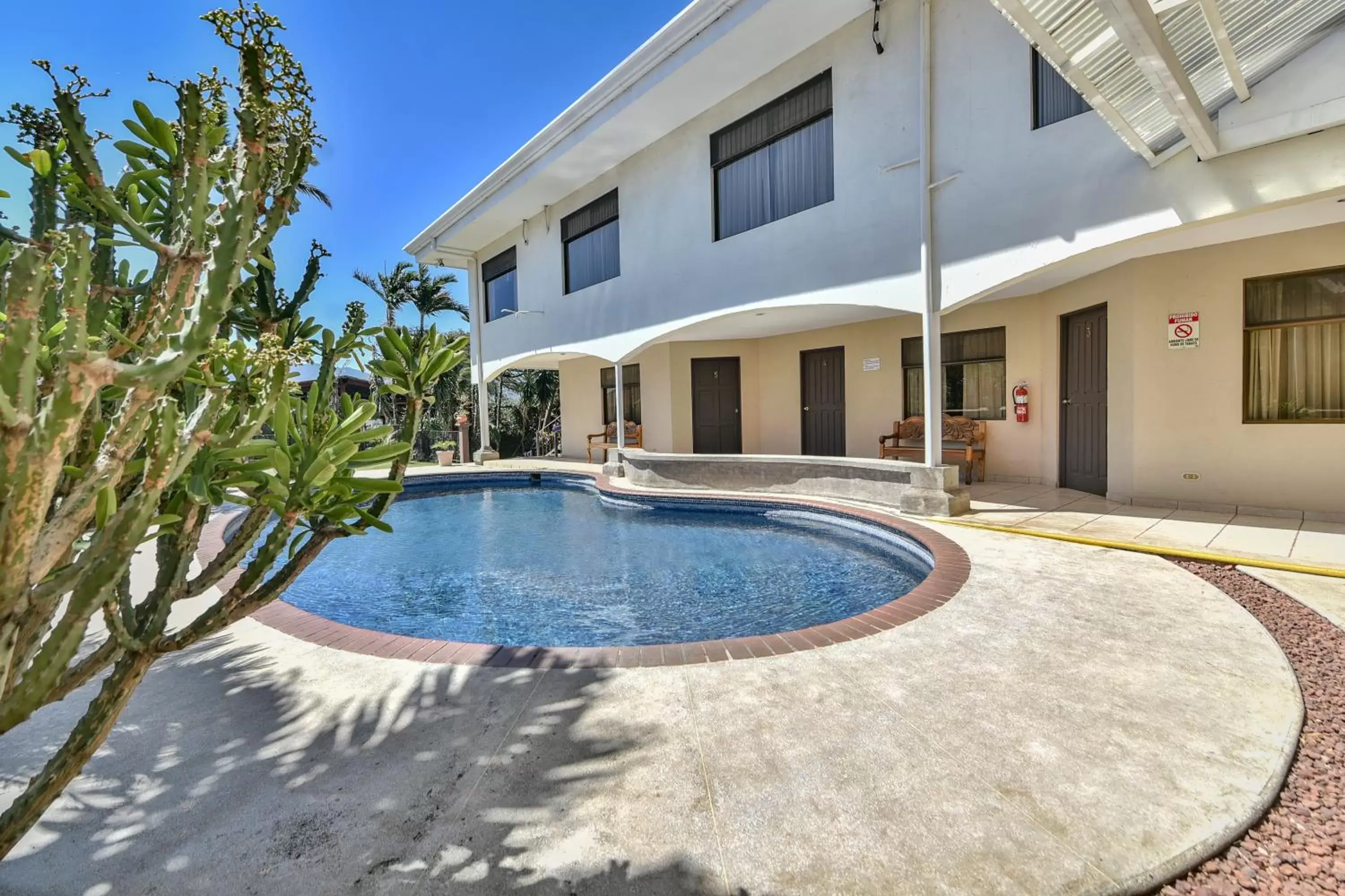 Swimming pool, Property Building in La Riviera Hotel