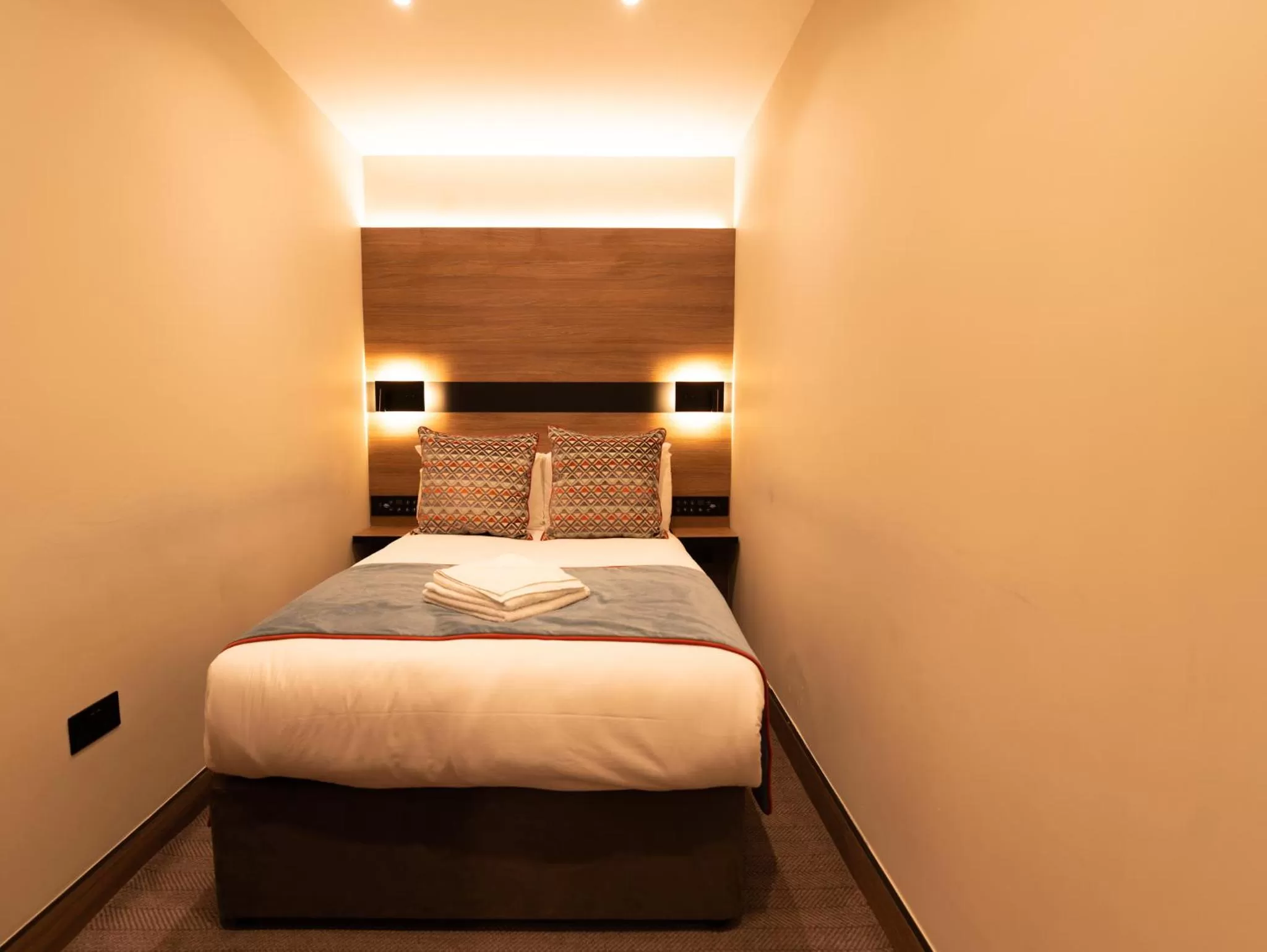 Bed in Merit Kensington Hotel