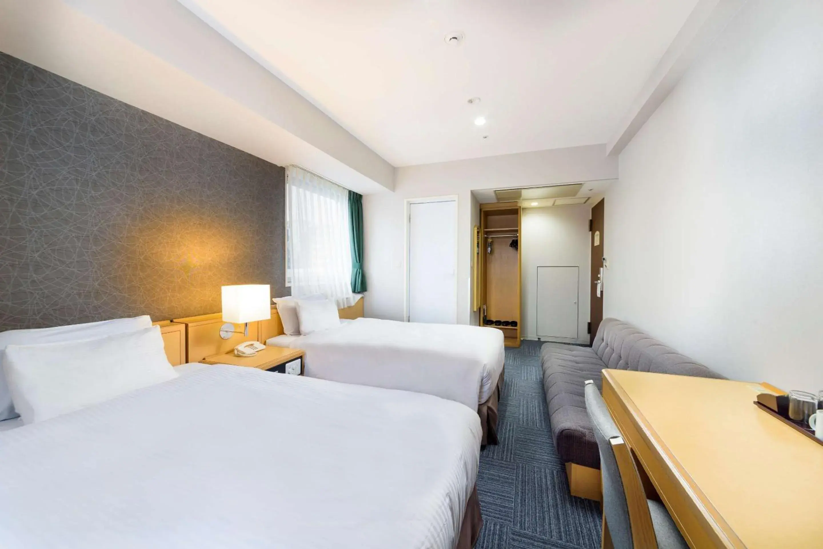 Bedroom in SureStay Plus Hotel by Best Western Shin-Osaka