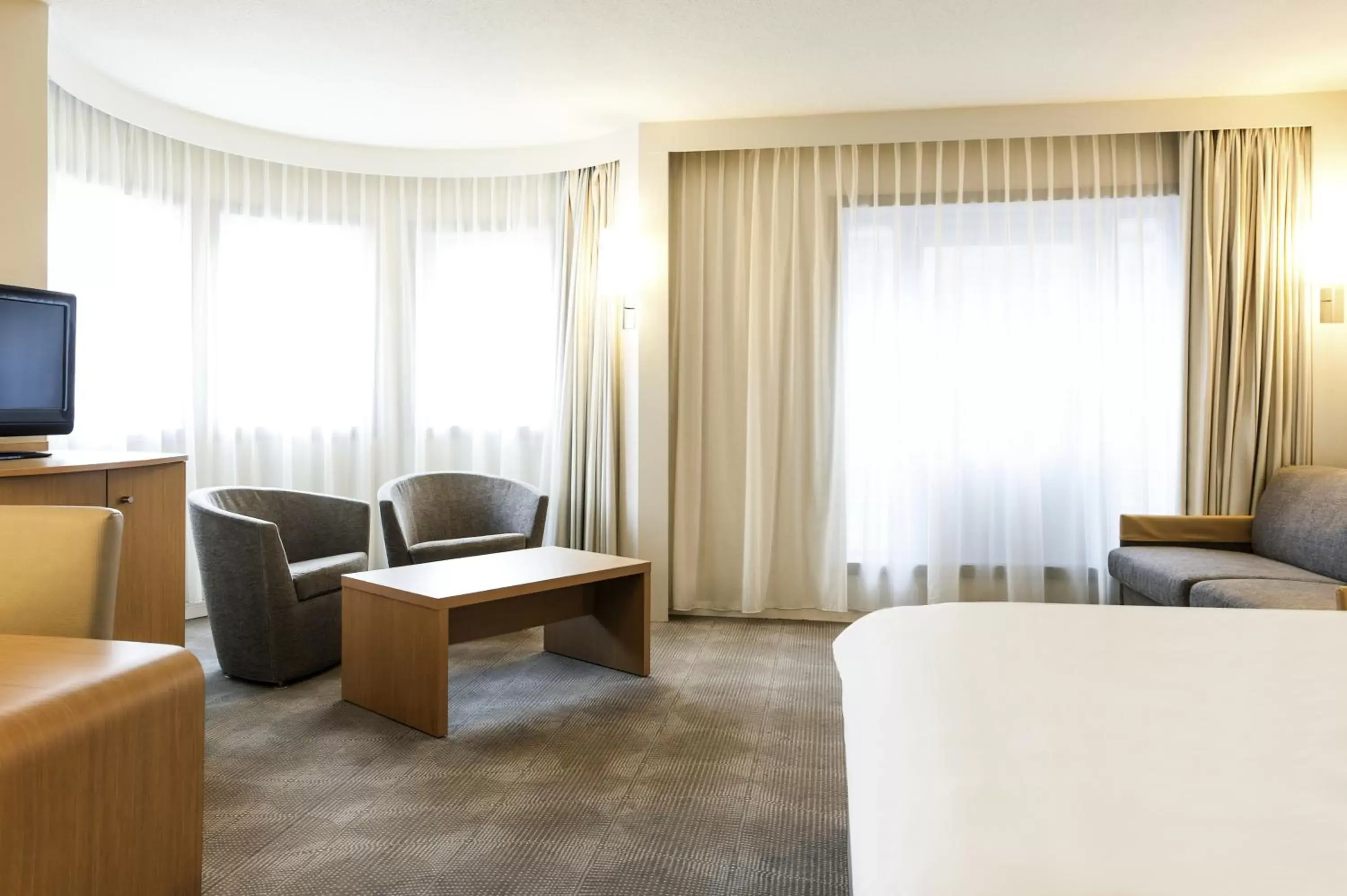 Bed, Seating Area in Novotel Gent Centrum