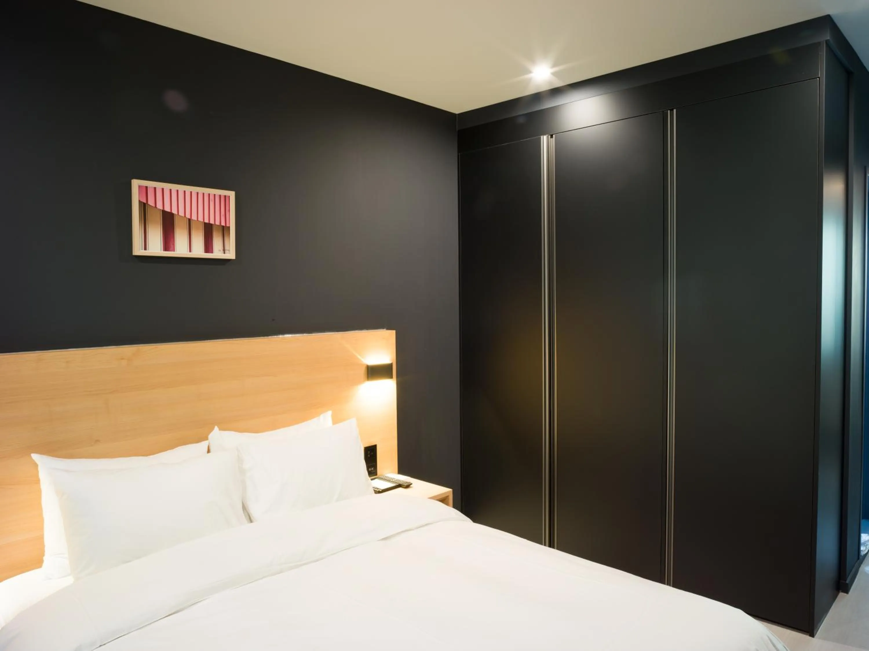 Bed in Mipo Oceanside Hotel