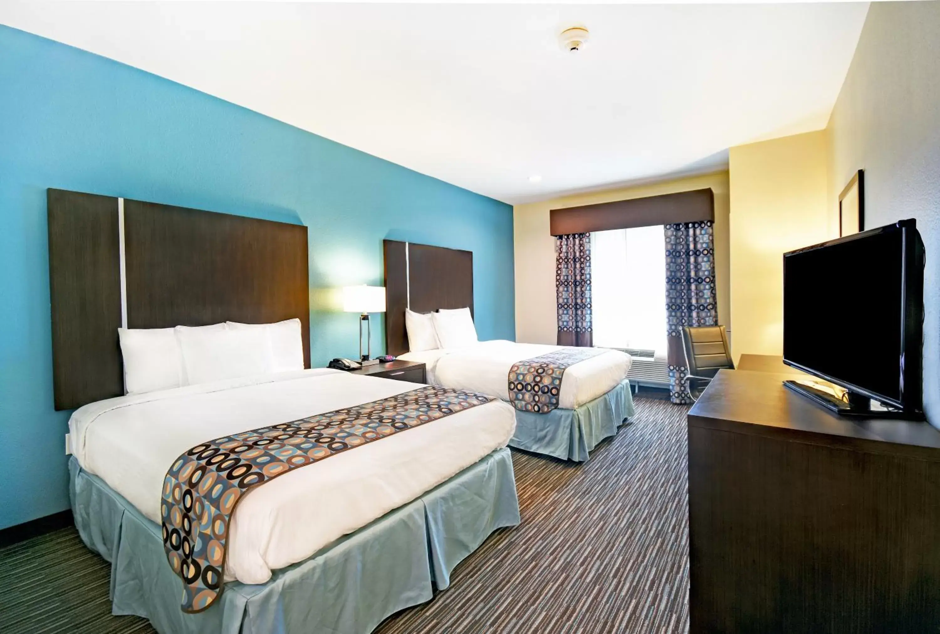 Bed in Galveston Inn & Suites Hotel
