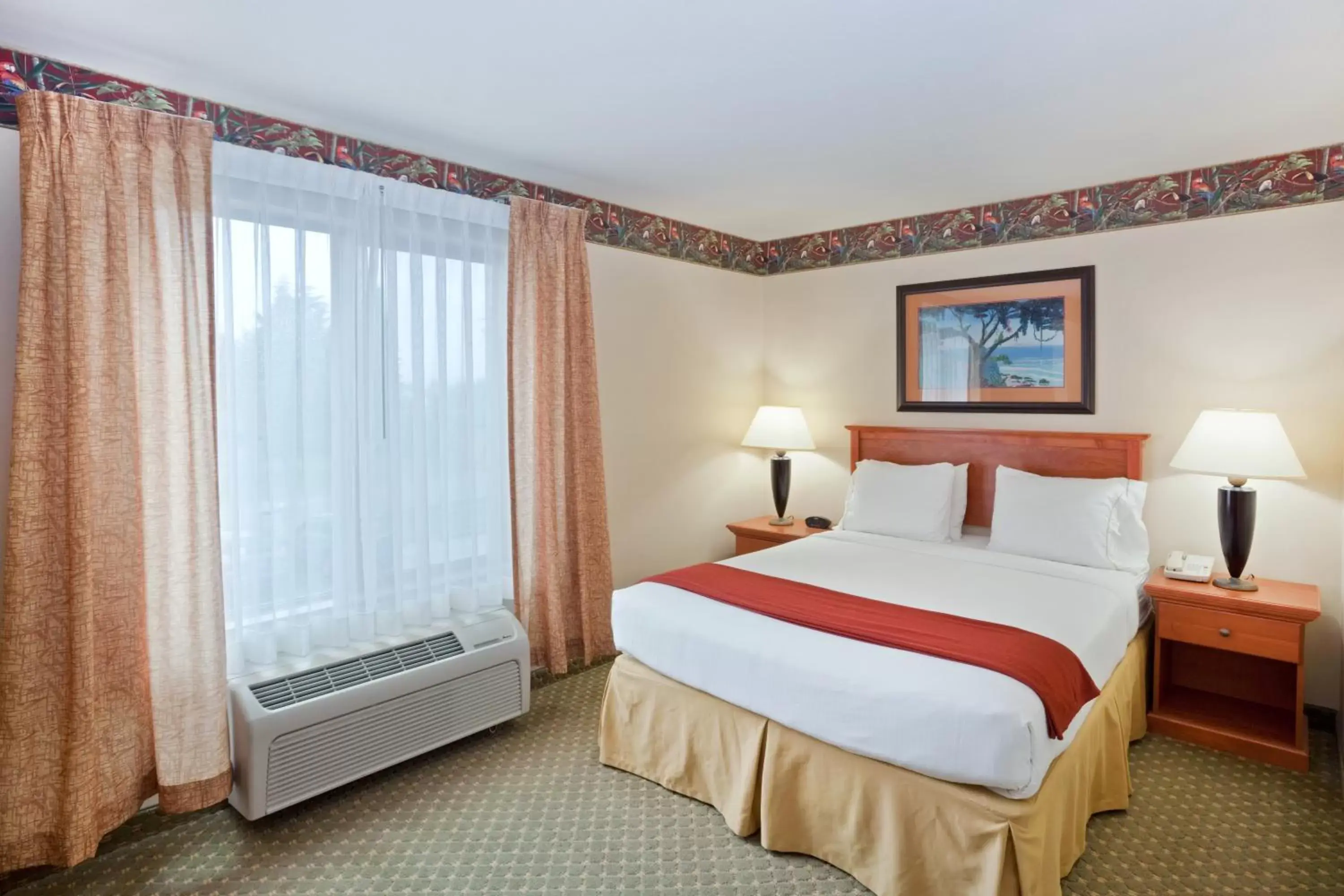 Bed in Triple Play Resort Hotel & Suites