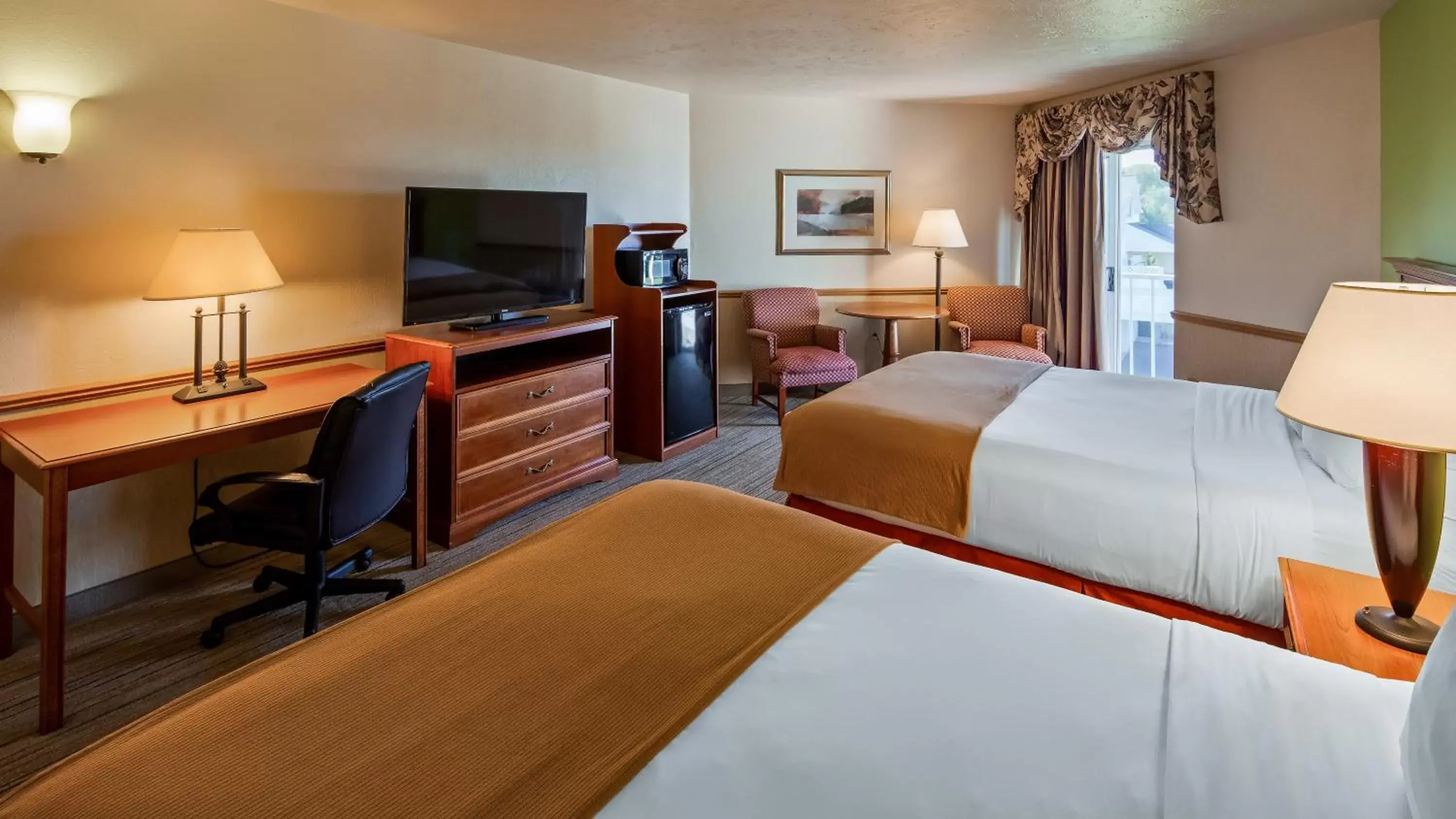 TV and multimedia in Apple Tree Inn; SureStay Collection by Best Western