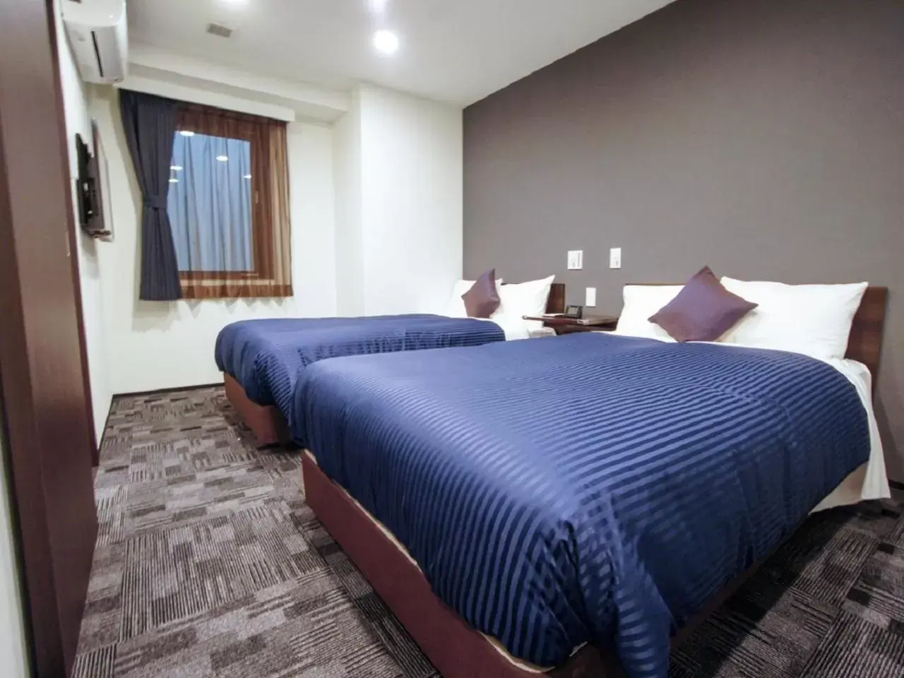 Bed in HOTEL LiVEMAX Nagoya Sakae East