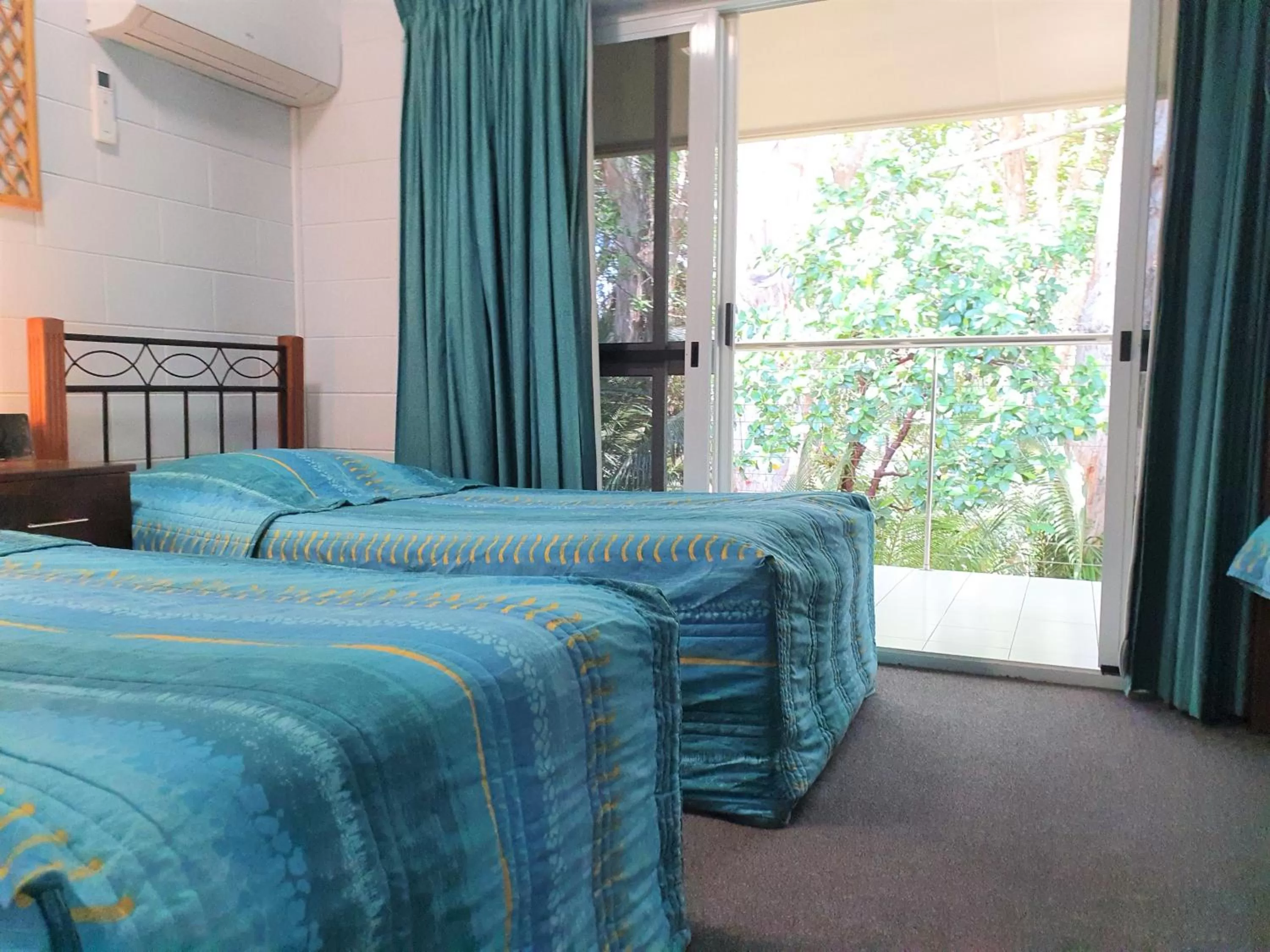 Bed in Mango Tree Holiday Apartments