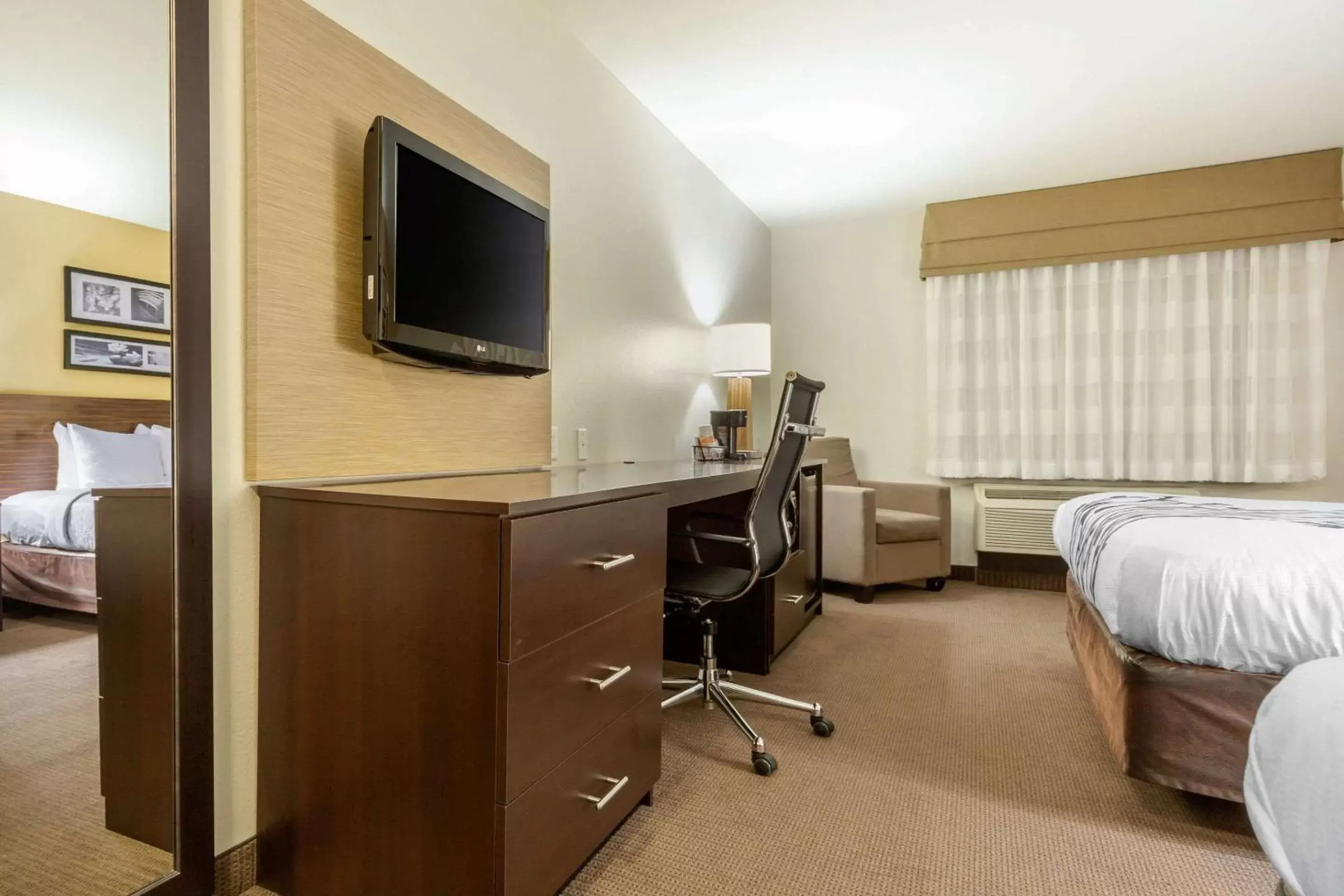 Photo of the whole room, TV/Entertainment Center in Sleep Inn & Suites Grand Forks Alerus Center