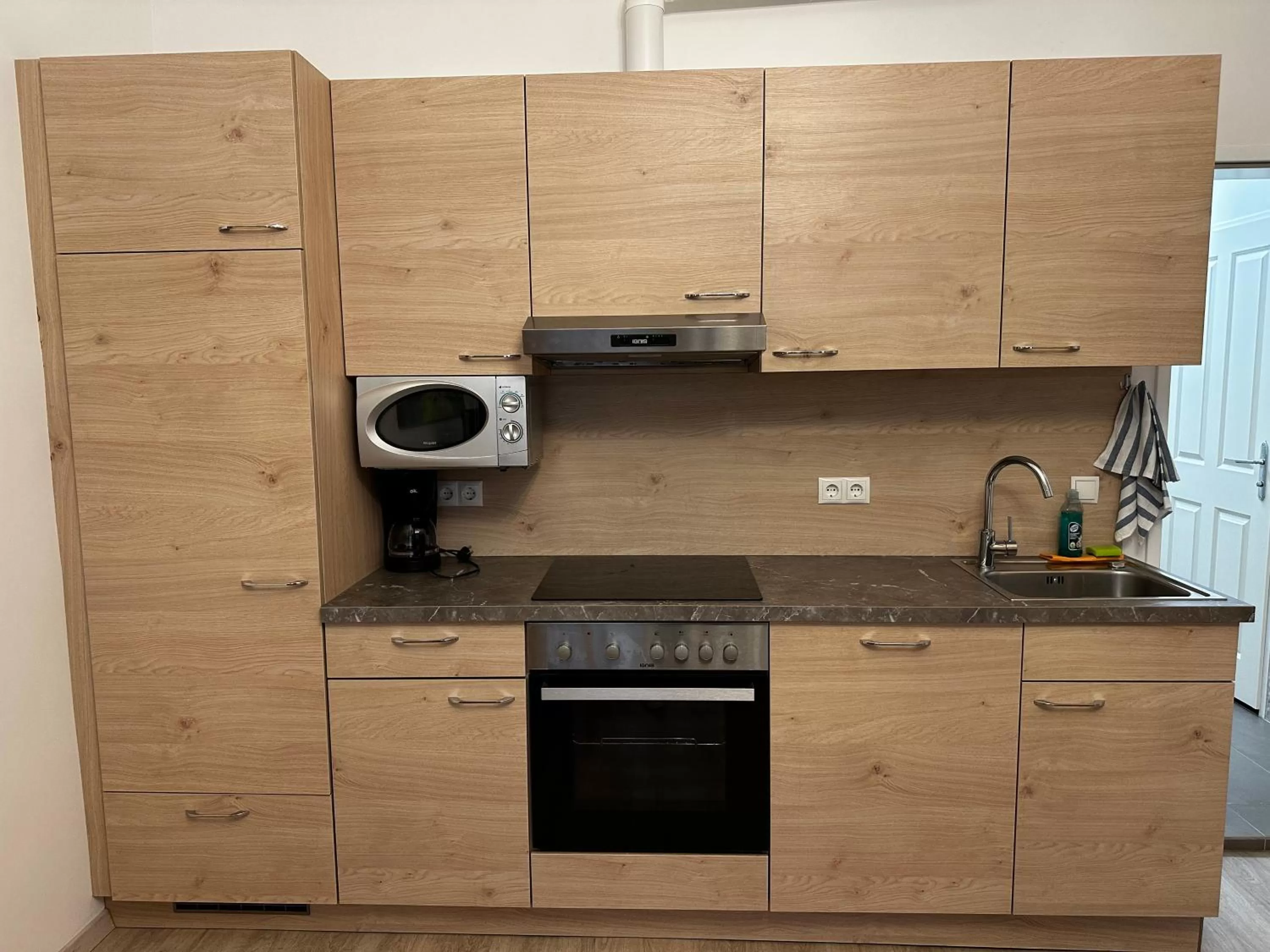 kitchen in AJO Apartments - Messe City Flat - Self-Check-in