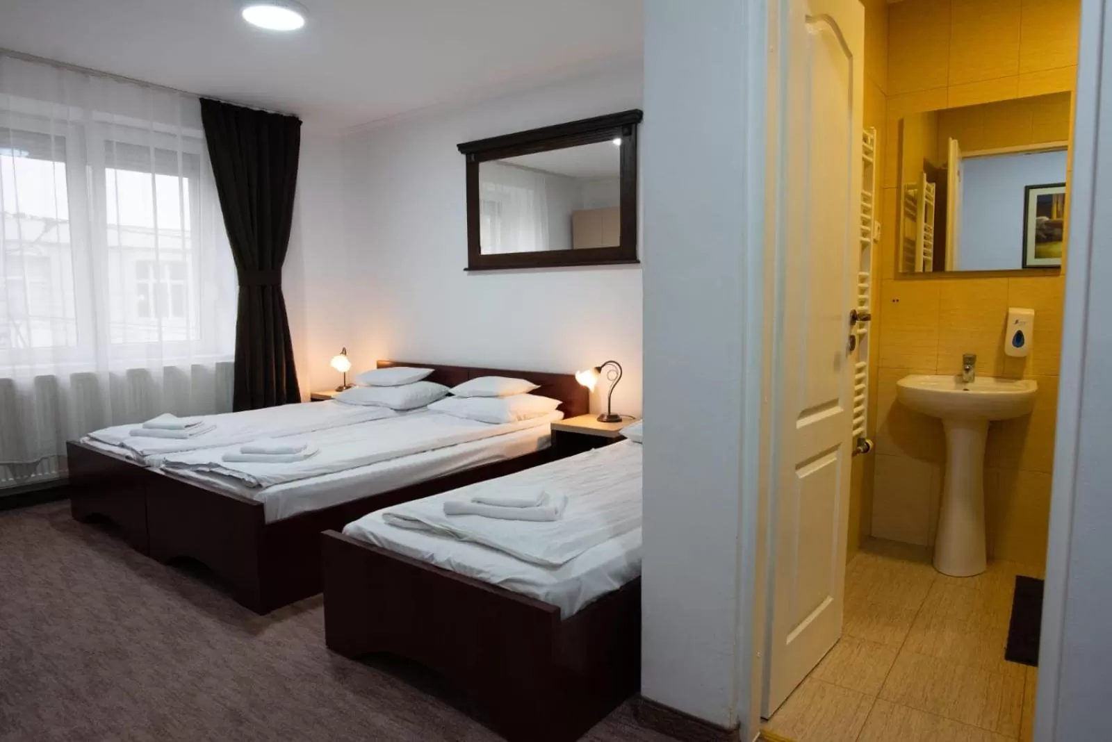 Bed in Carnival City Hotel Oradea