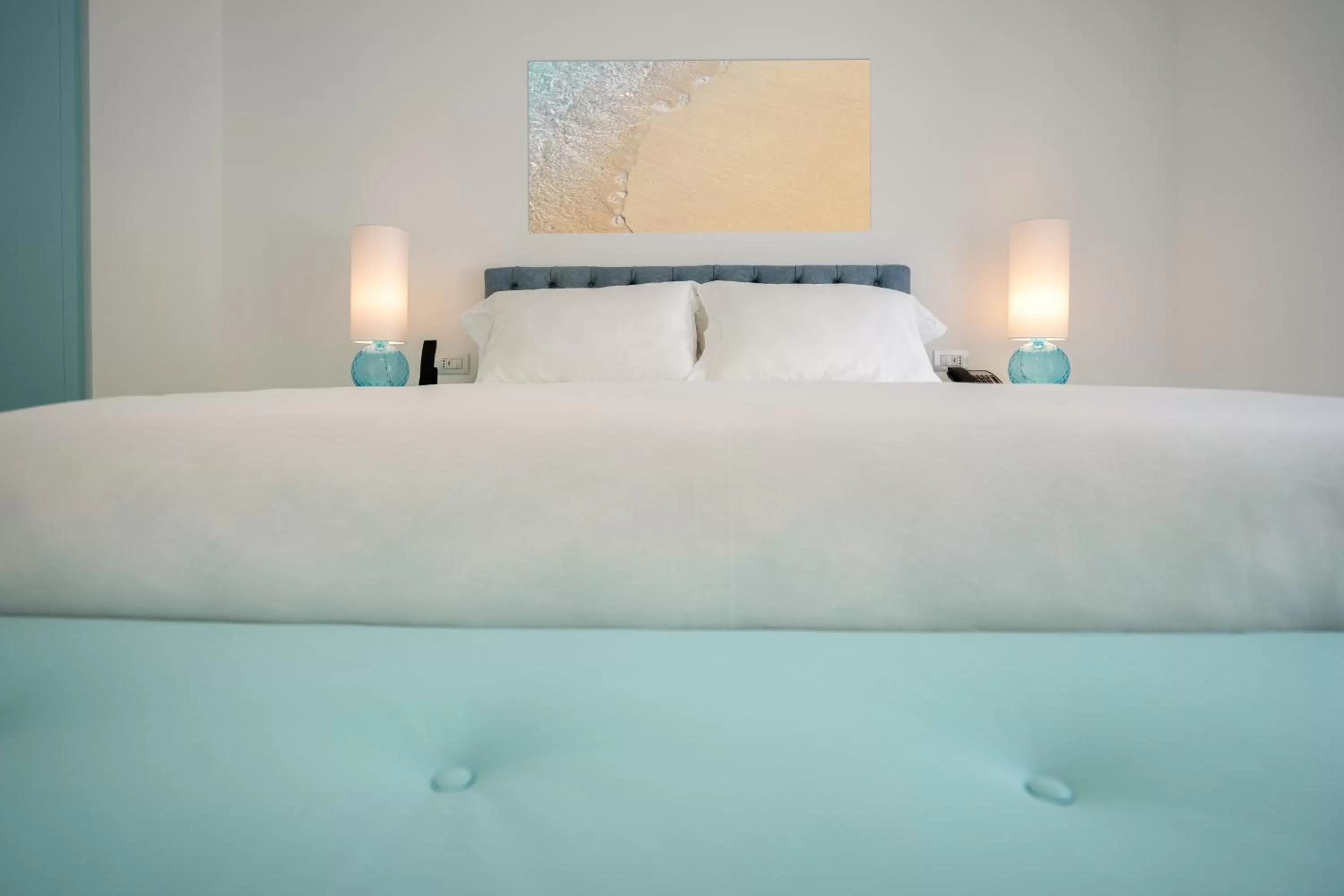 Bed in Grotta Palazzese Beach Hotel