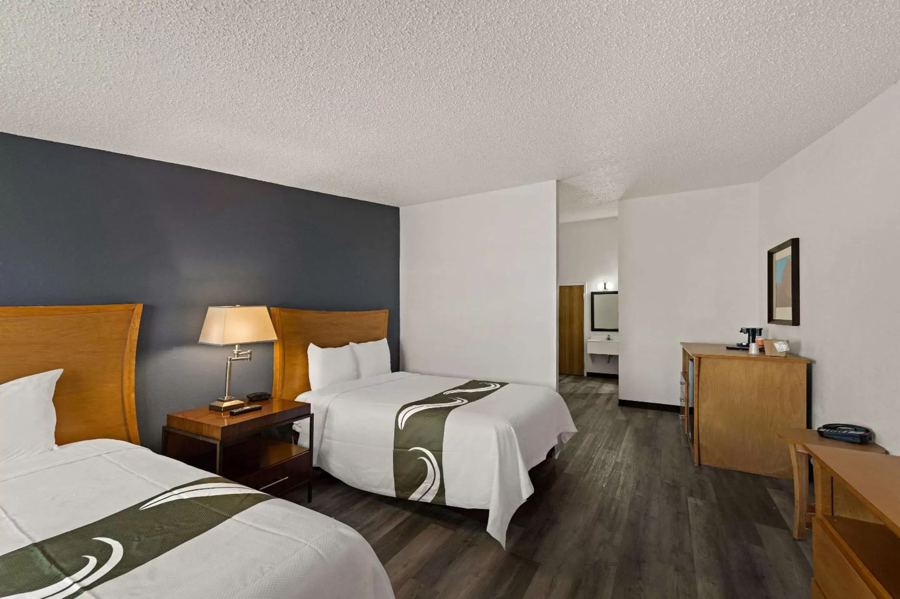 Bedroom in Quality Inn & Suites near I-480 and I-29