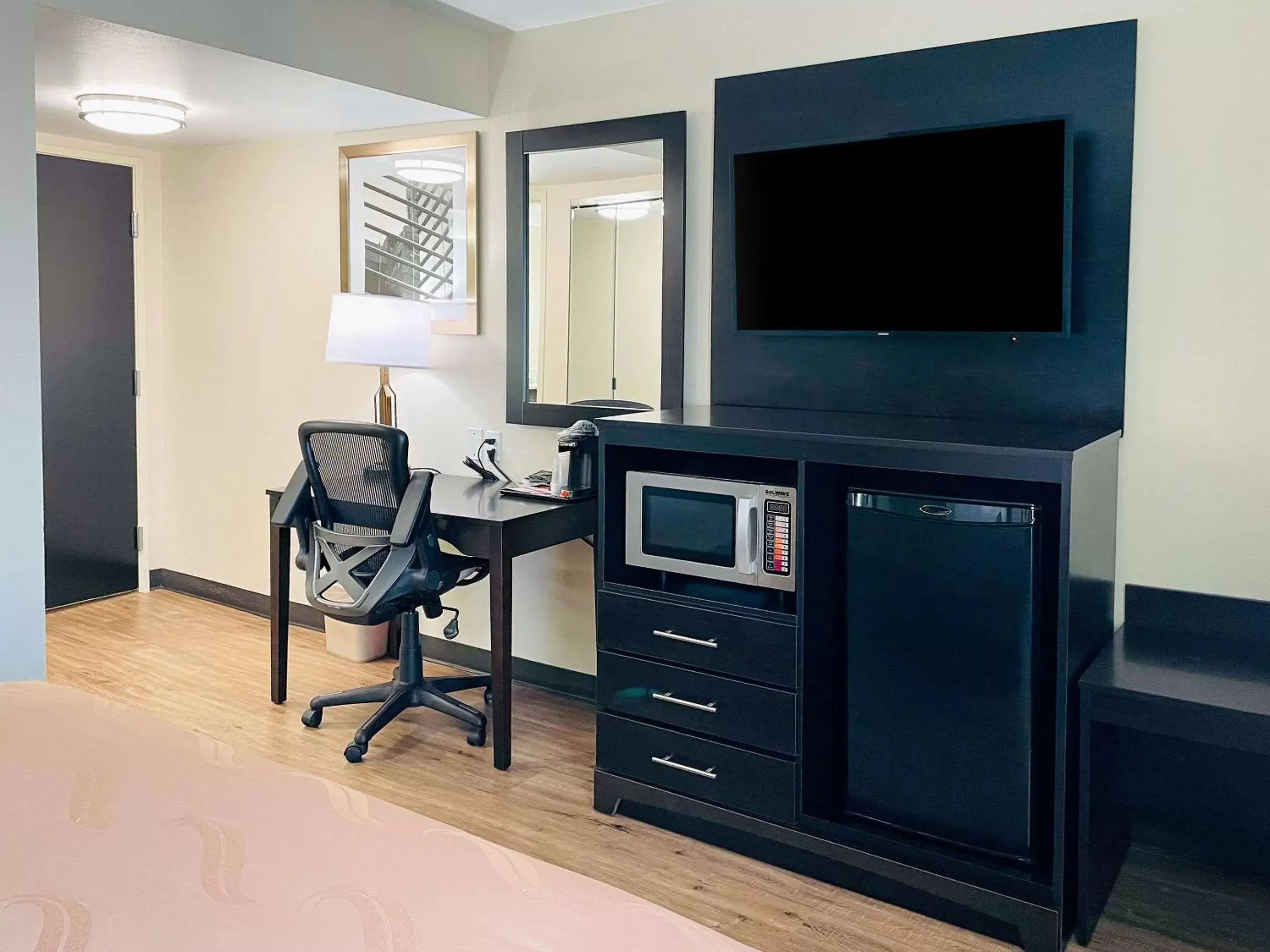 Photo of the whole room, TV/Entertainment Center in Quality Inn & Suites Lake Charles