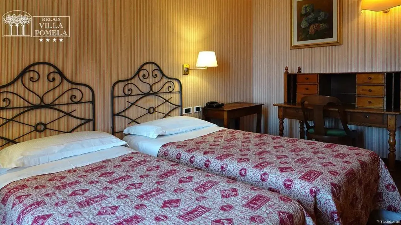 Bed in Relais Villa Pomela