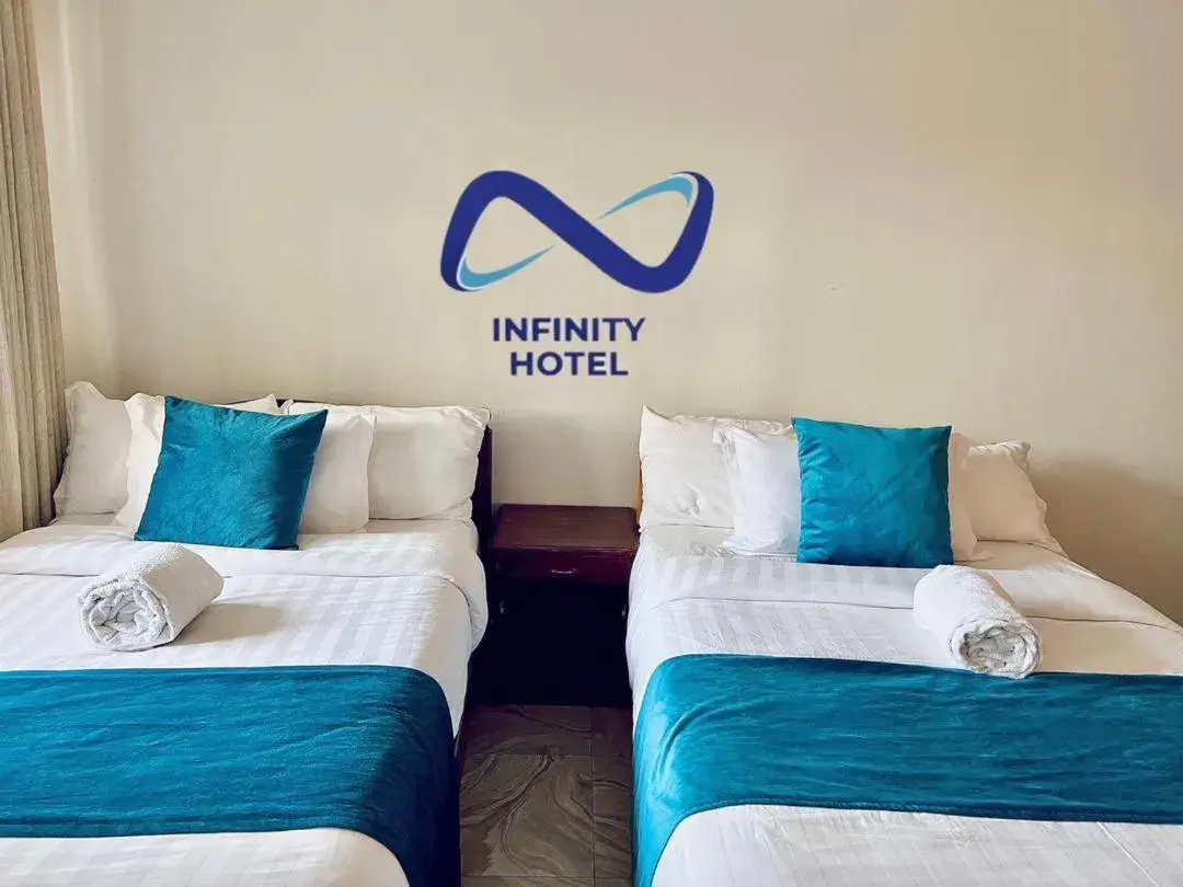 Bed in Infinity Hotel Kampala