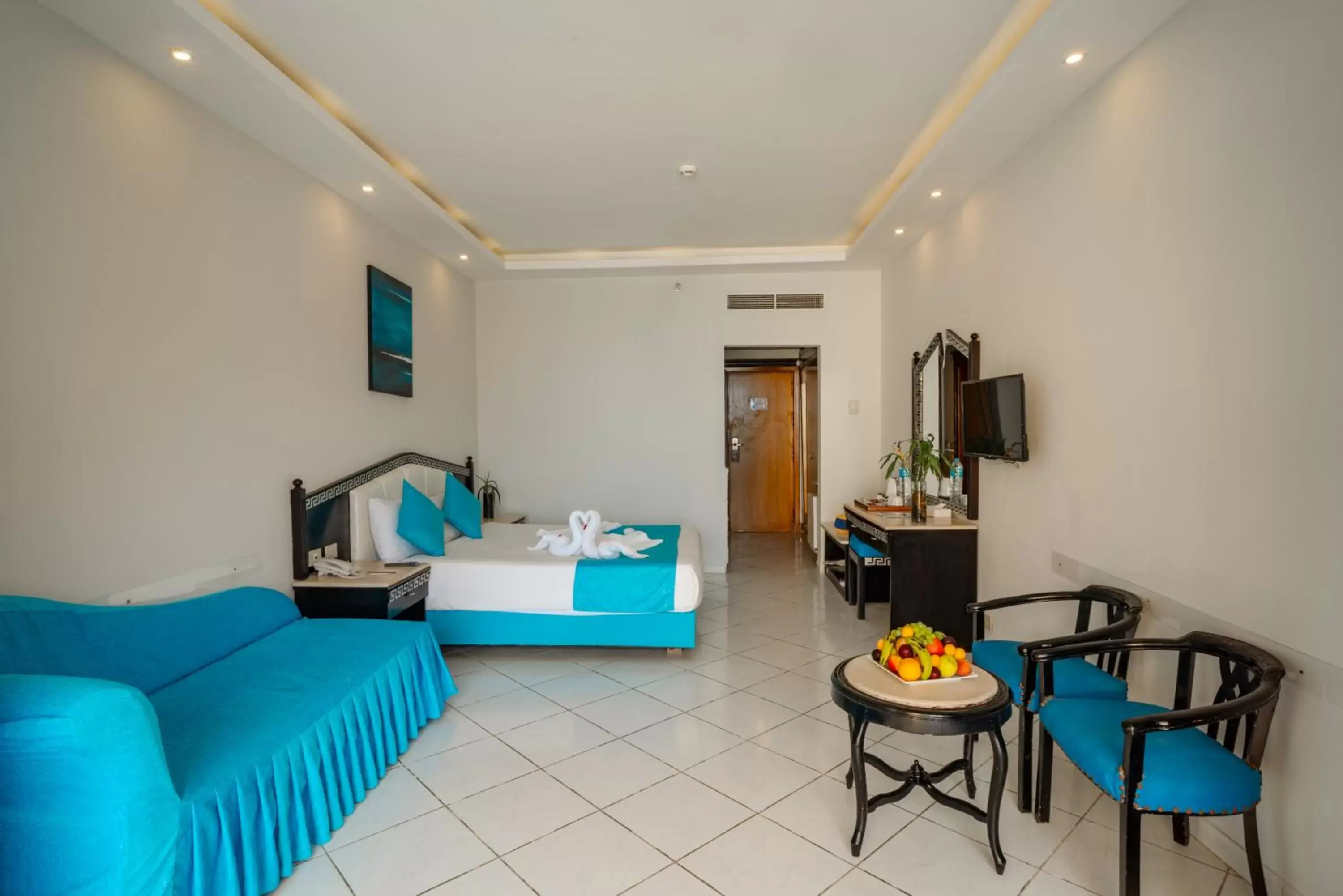 Seating area, Bed in King Tut Aqua Park Beach Resort Seating area, Bed in King Tut Aqua Park Beach Resort