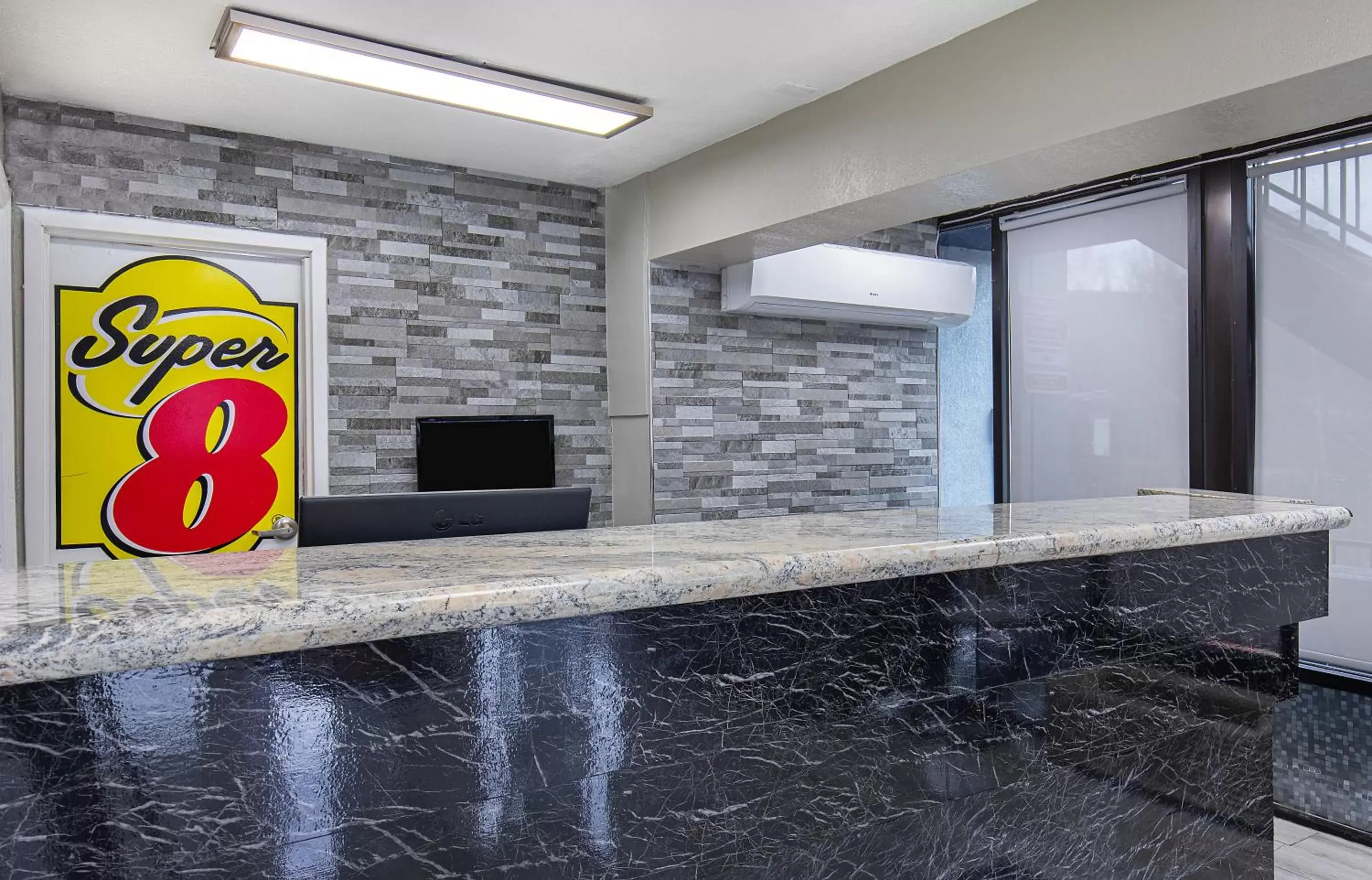 Lobby or reception in Super 8 by Wyndham Nashville West Lobby or reception in Super 8 by Wyndham Nashville West